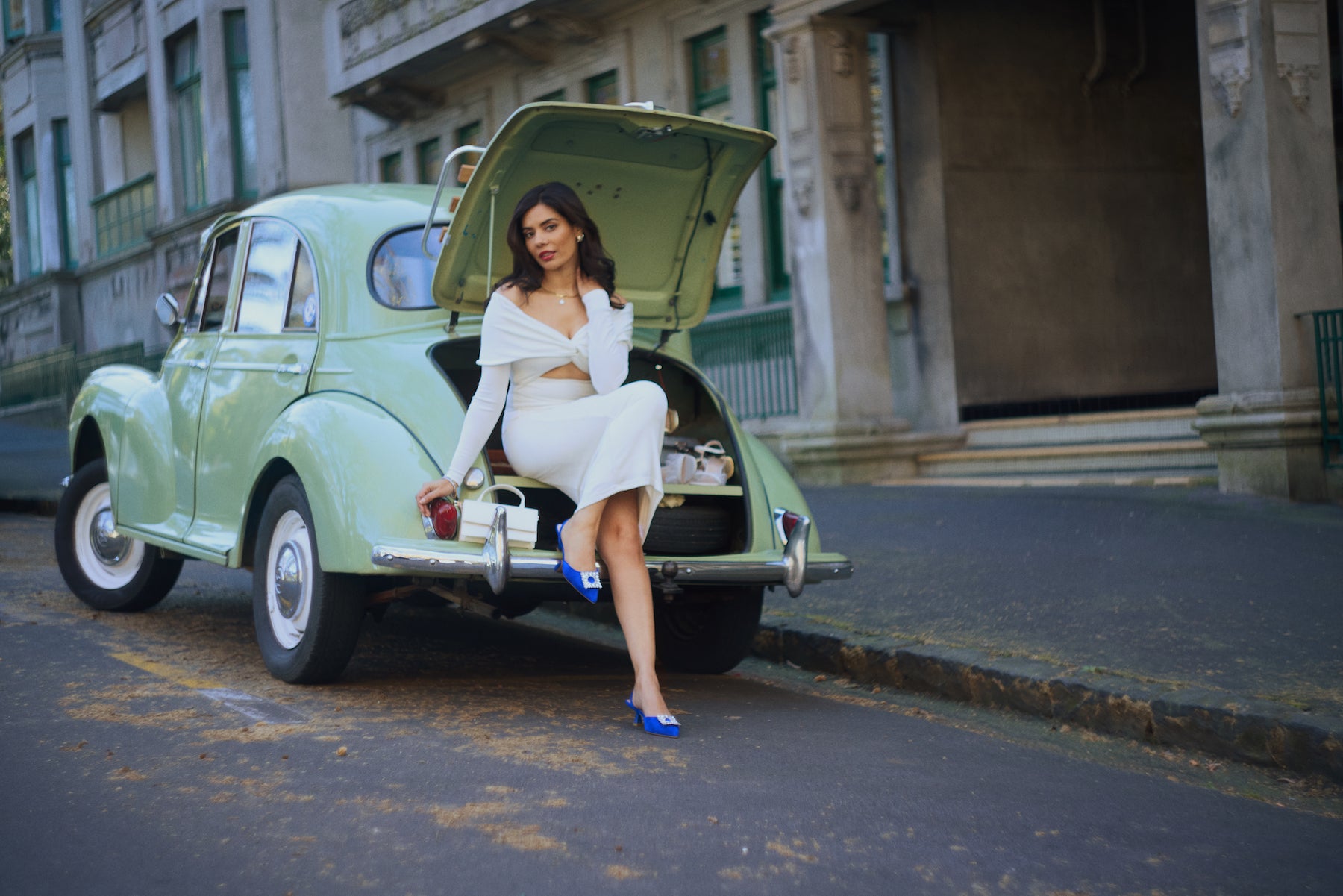 Campaign photo of woman wearing cobalt blue sling back heel, Sasha, in suede leather.
