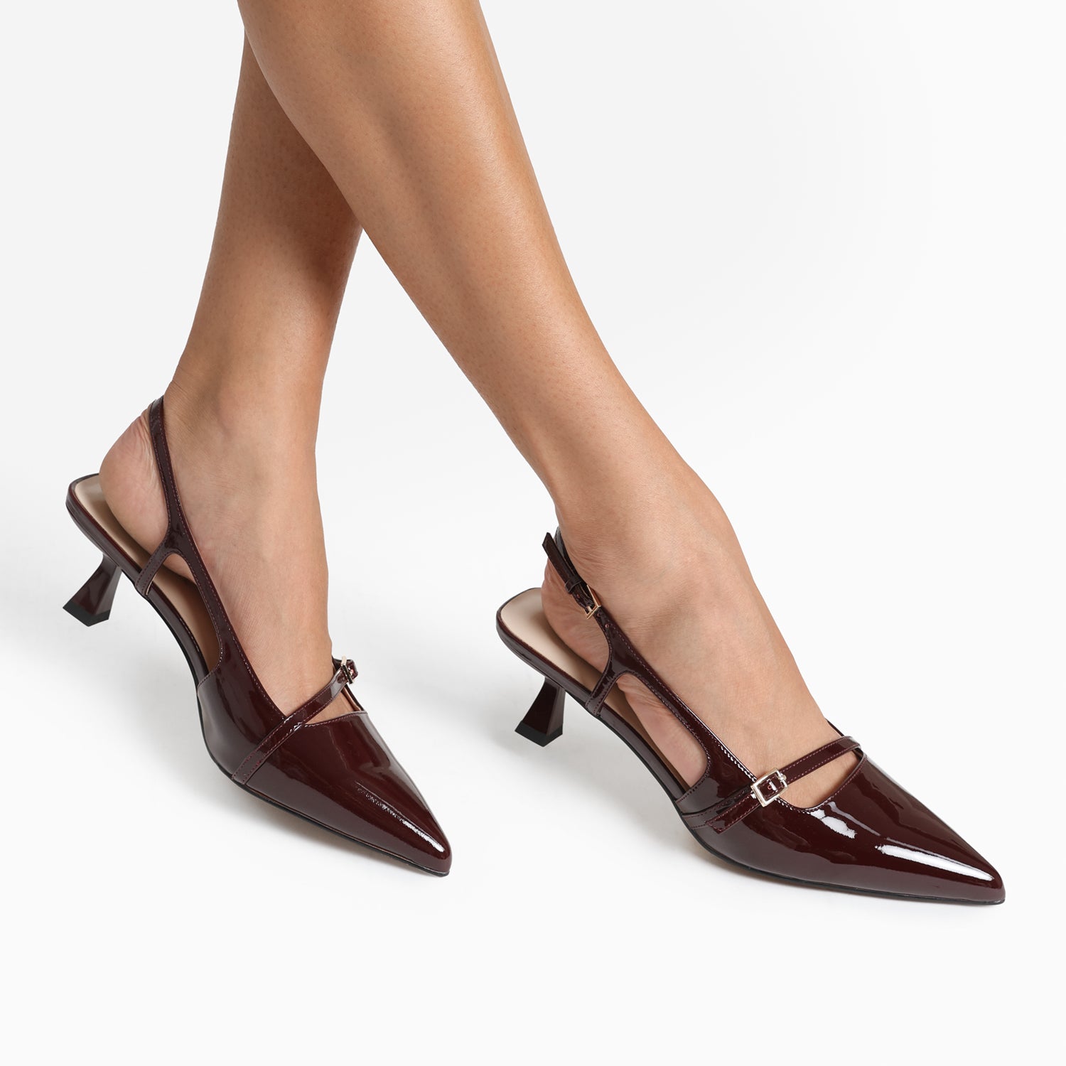 Sevilla pinot noir slingback shown on models feet.
