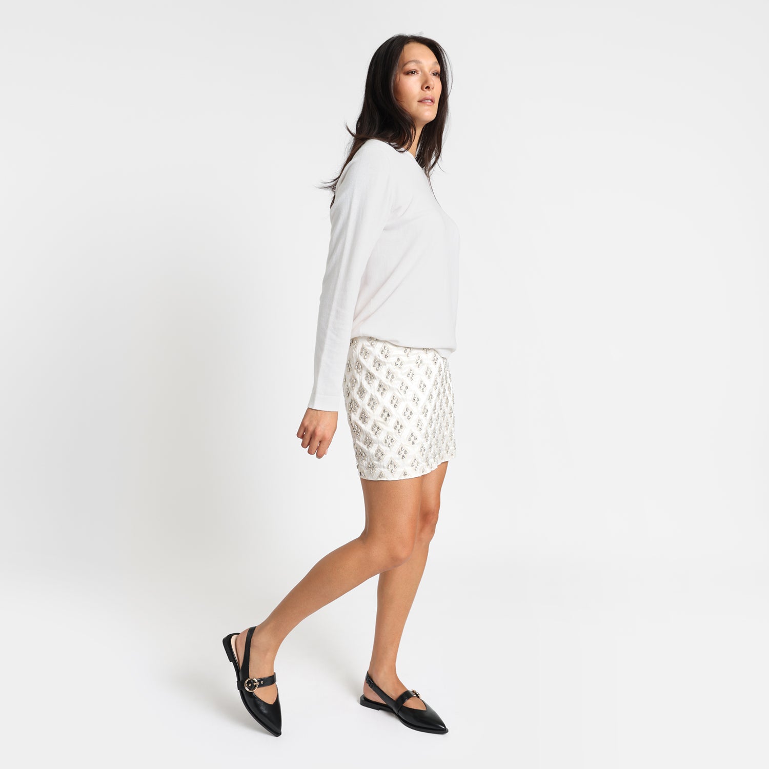 Model wears Valencia black sling back.