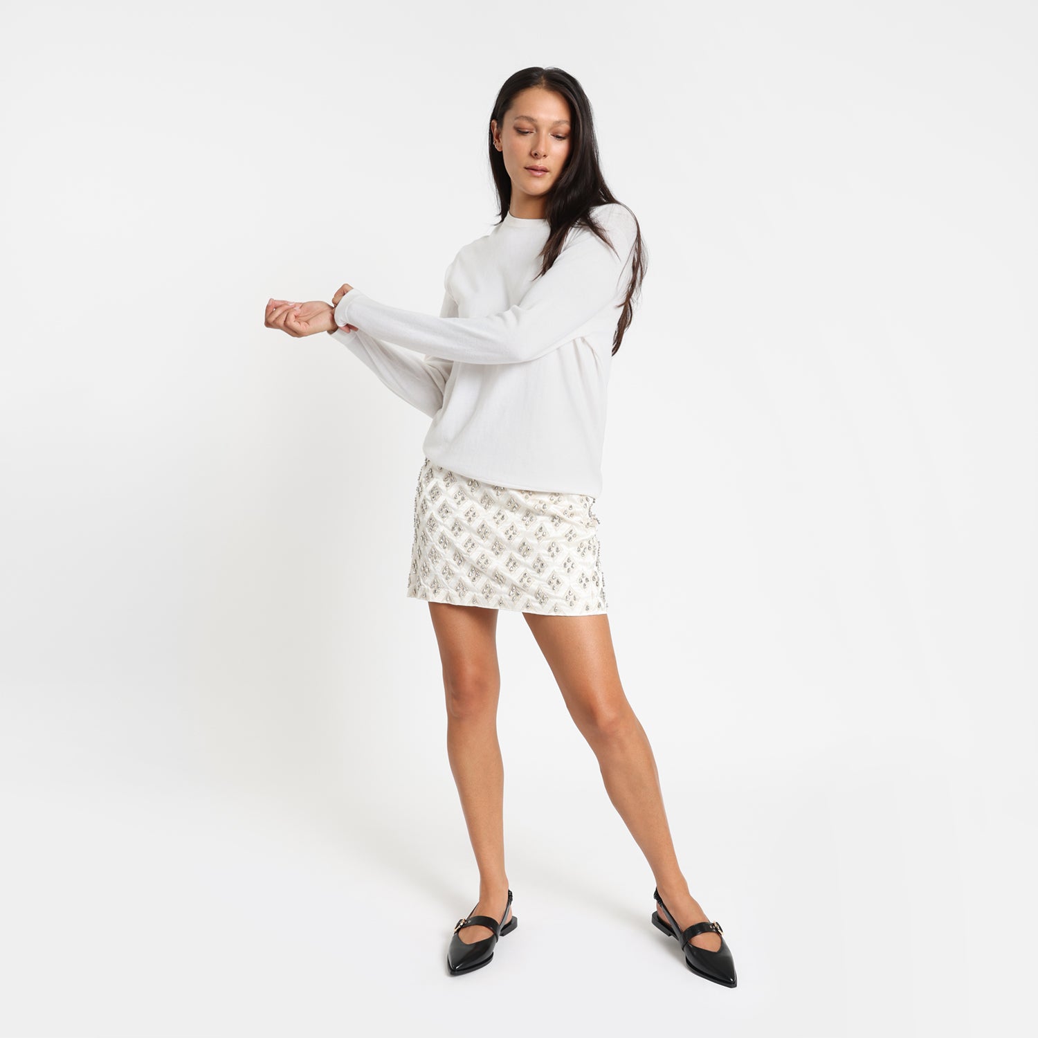 Model wears Valencia black sling back.