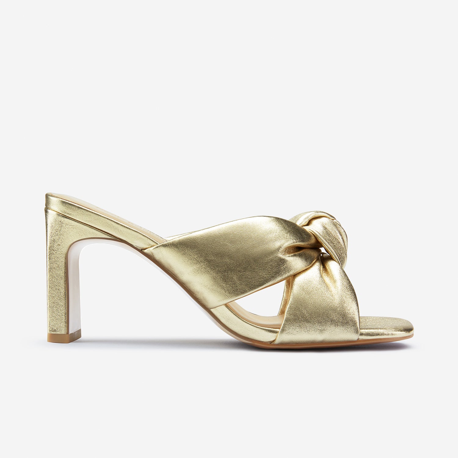 Velma gold leather sandal shown from the side.