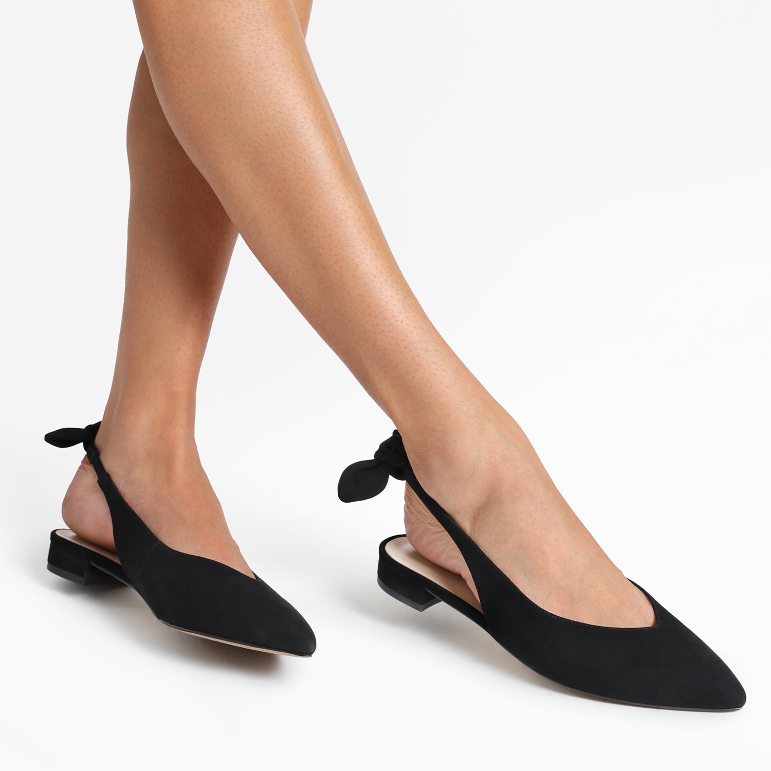 Vienna black suede slingback with pointed toe and bow shown on women's feet.