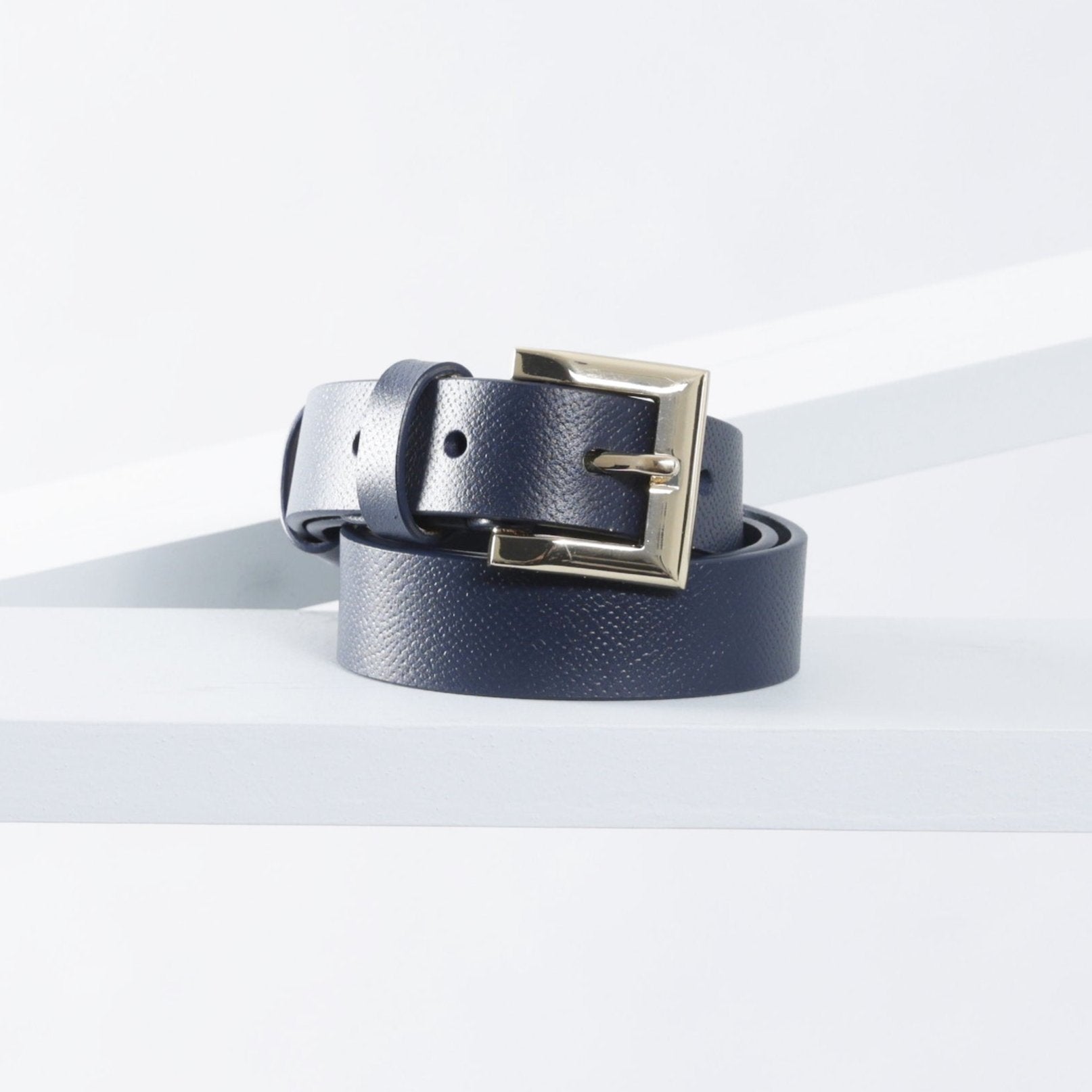 A navy leather belt with a gold buckle, displayed on a white background.