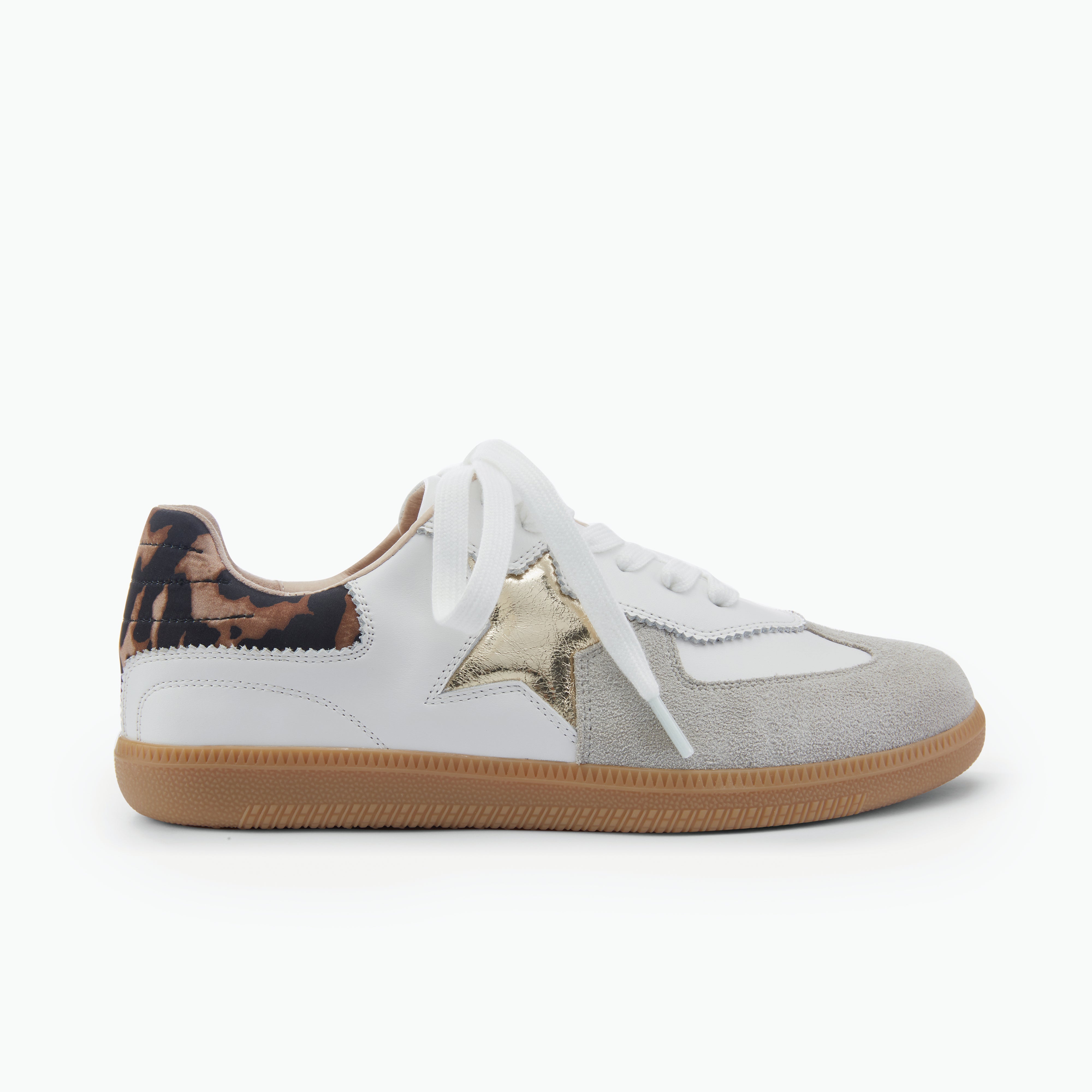 White sneaker with gold star and brown sole on a white background by NIcole Rebstock