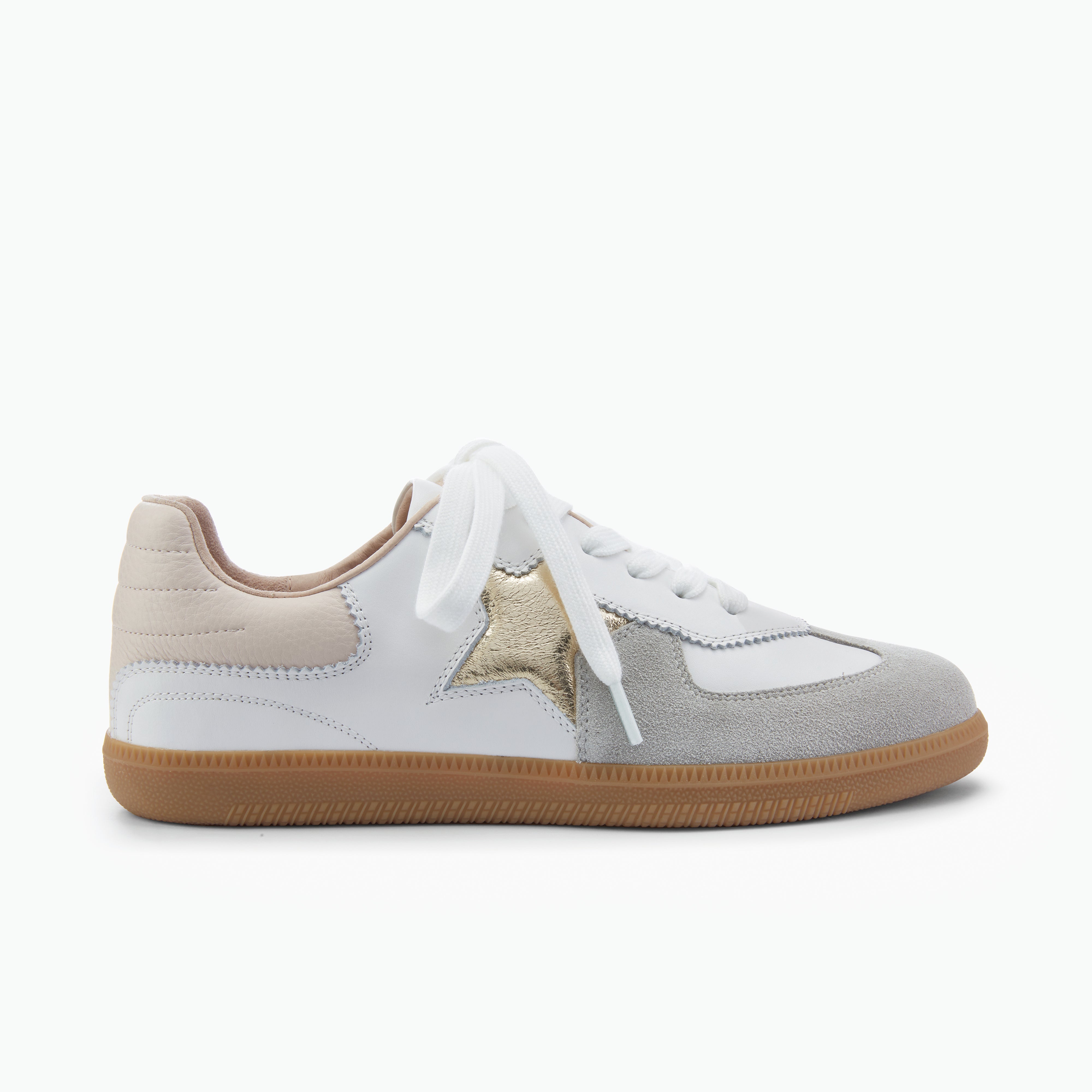 White sneaker with gold star and brown sole on a white background by Nicole Rebstock