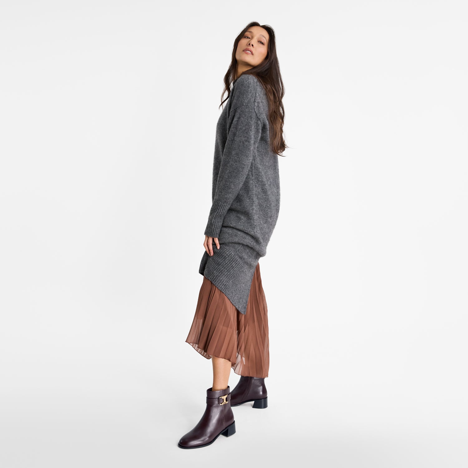 Woman wearing Nicole Rebstock Bailey ankle boots in brown leather with round toe and black block heel 4.5cm.