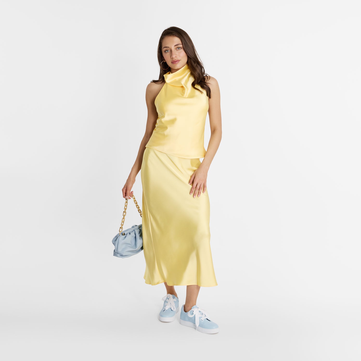 Model wearing Nicole Rebstock Blaize Sneaker in powder blue leather with white oversized laces.