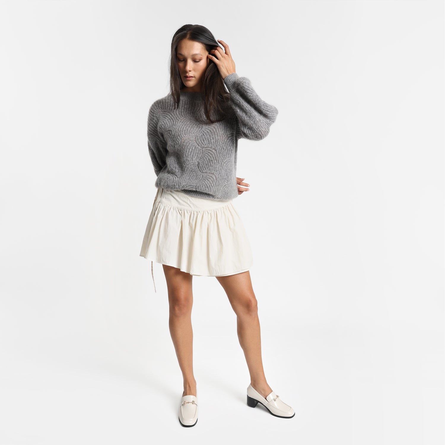 Woman wears Bremen Loafer in ivory with 4.5cm block heel.