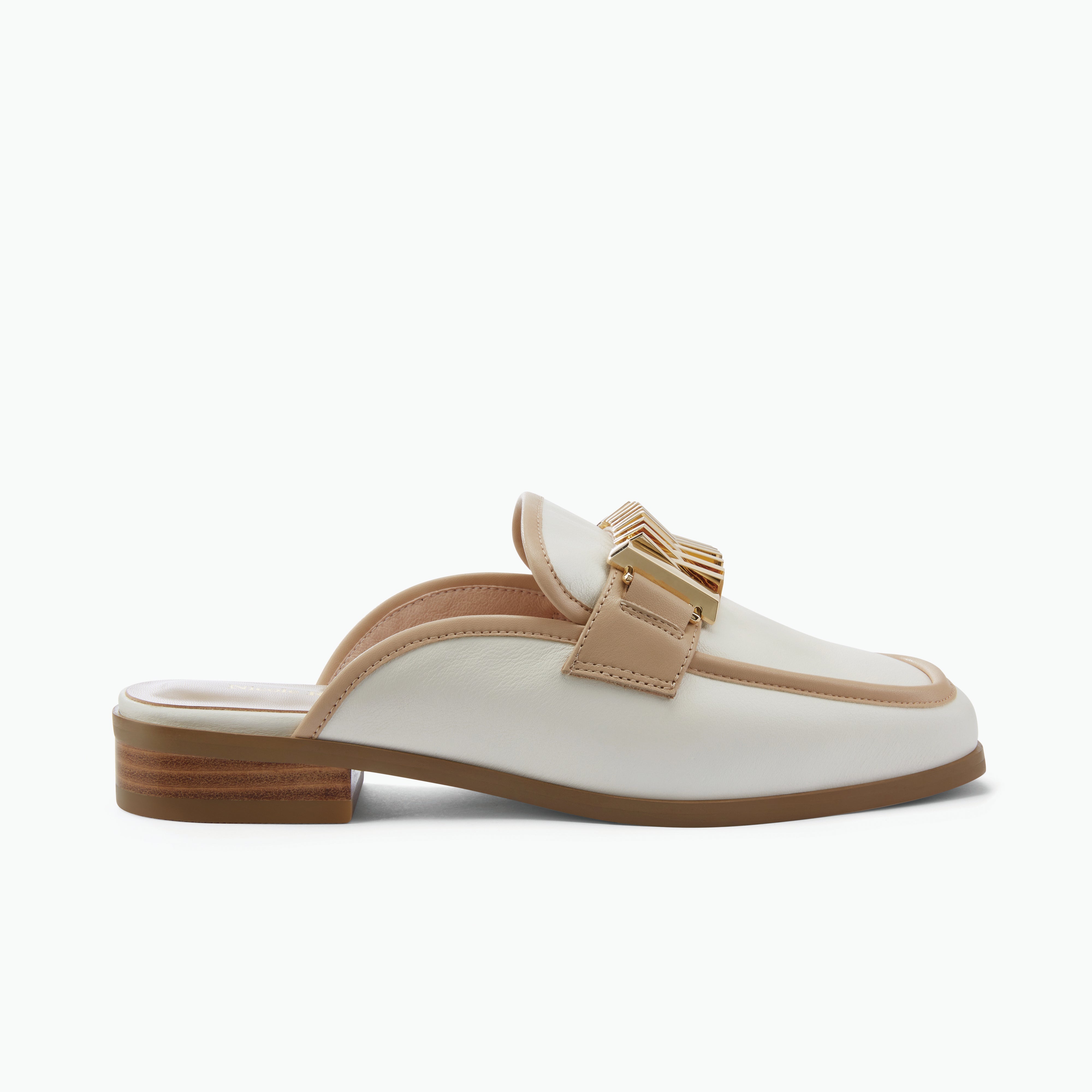 White loafer with nude trim and gold buckle on a white background by Nicole Rebstock