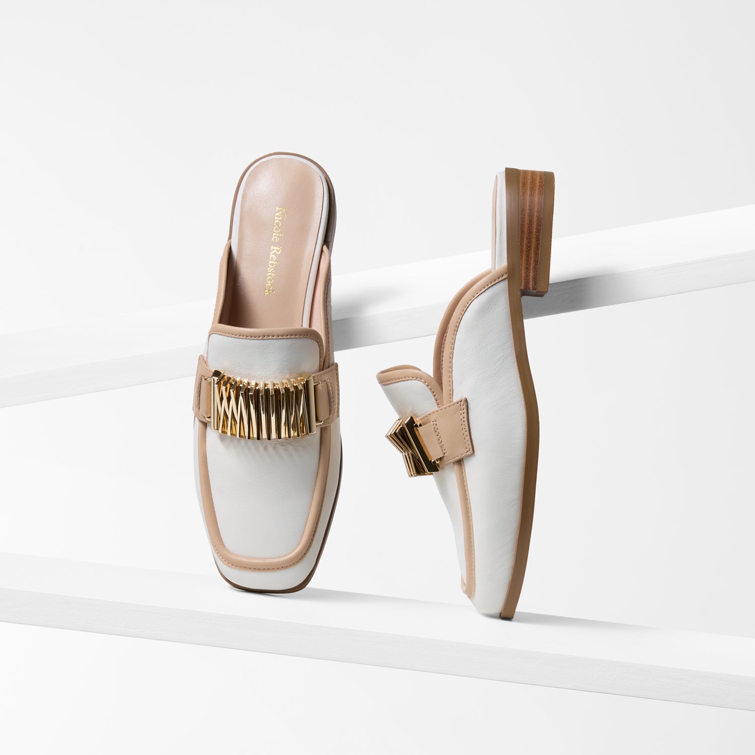 cream mule leather loafers with nude and gold accents on a white background. Square toe. 2.5cm heel.