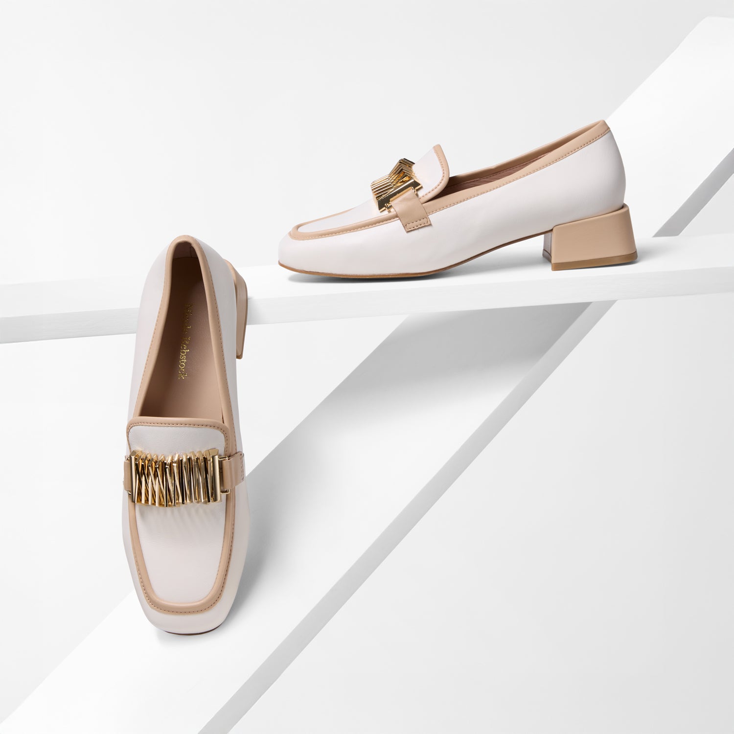 White loafers with nude and gold accents on a white background. 3.5cm block heel.