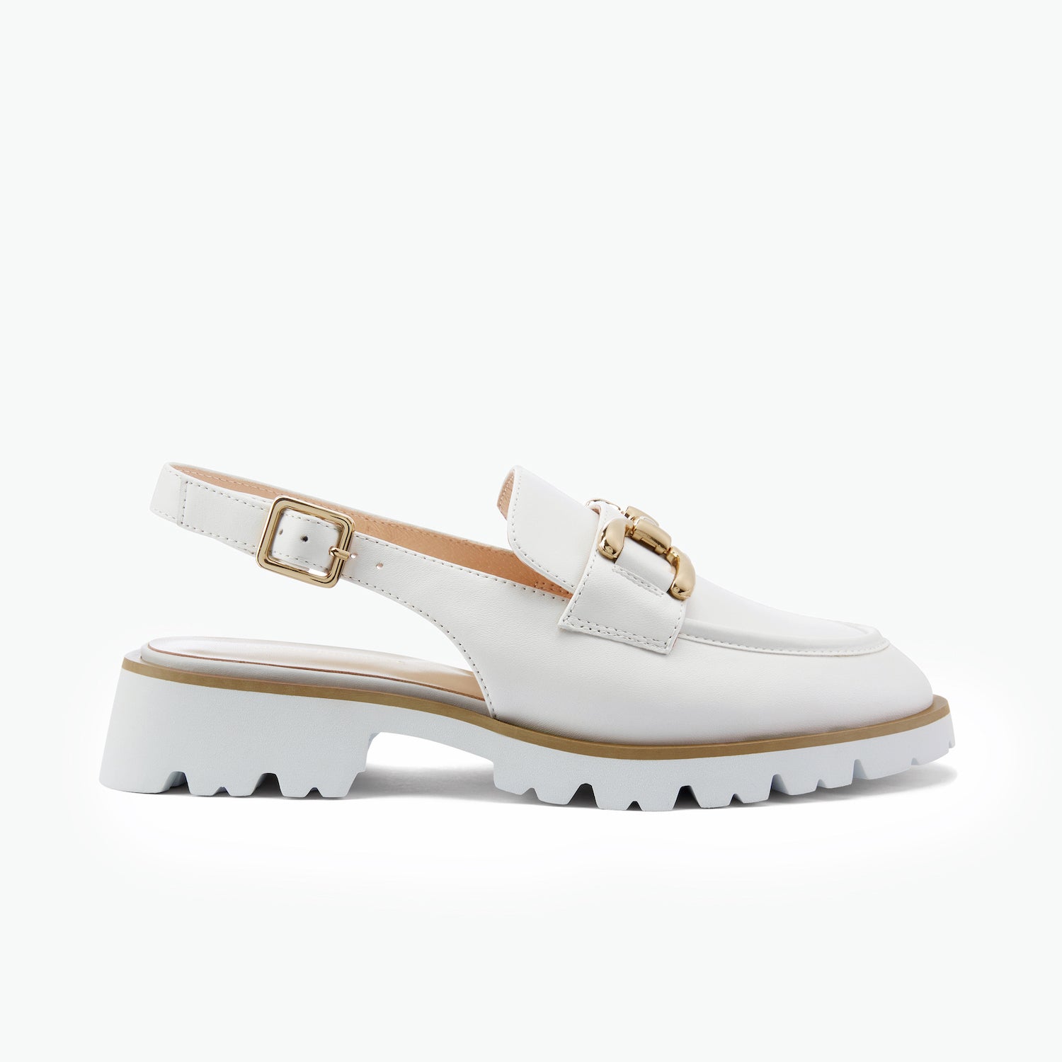 White slinback flat with gold buckle on a white background