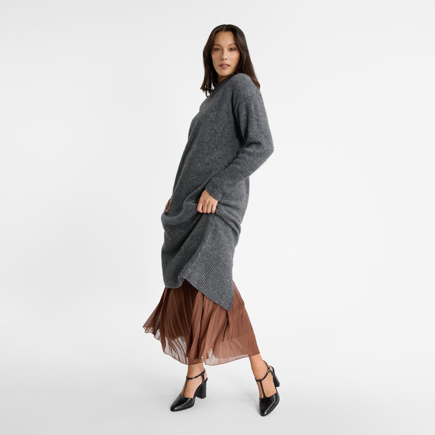 Woman wearing black t bar shoes with block heel by Nicole Rebstock. 8cm heel.