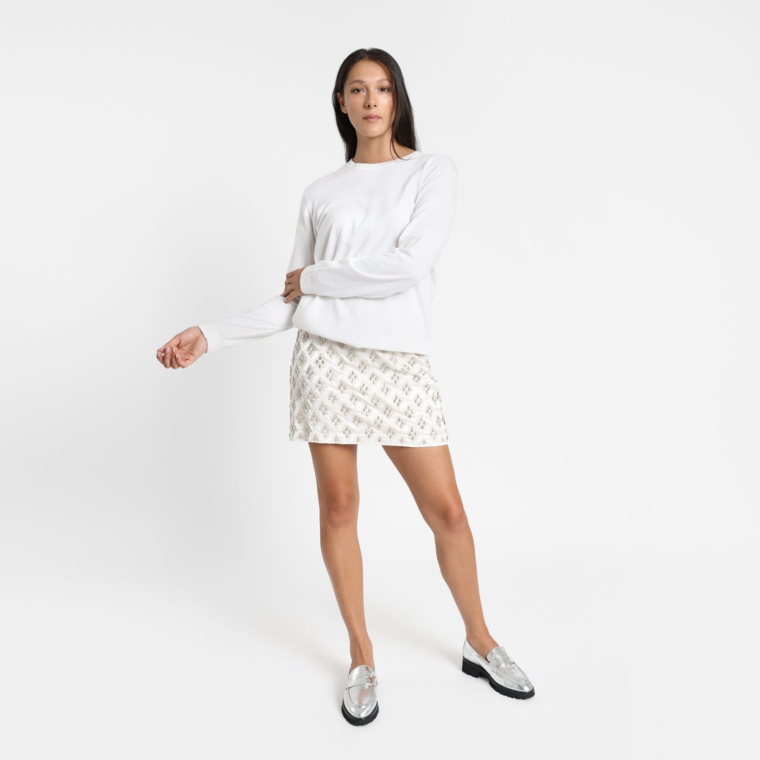 Model wears Czech Loafer in silver leather with black outsole. 2.5cm heel.