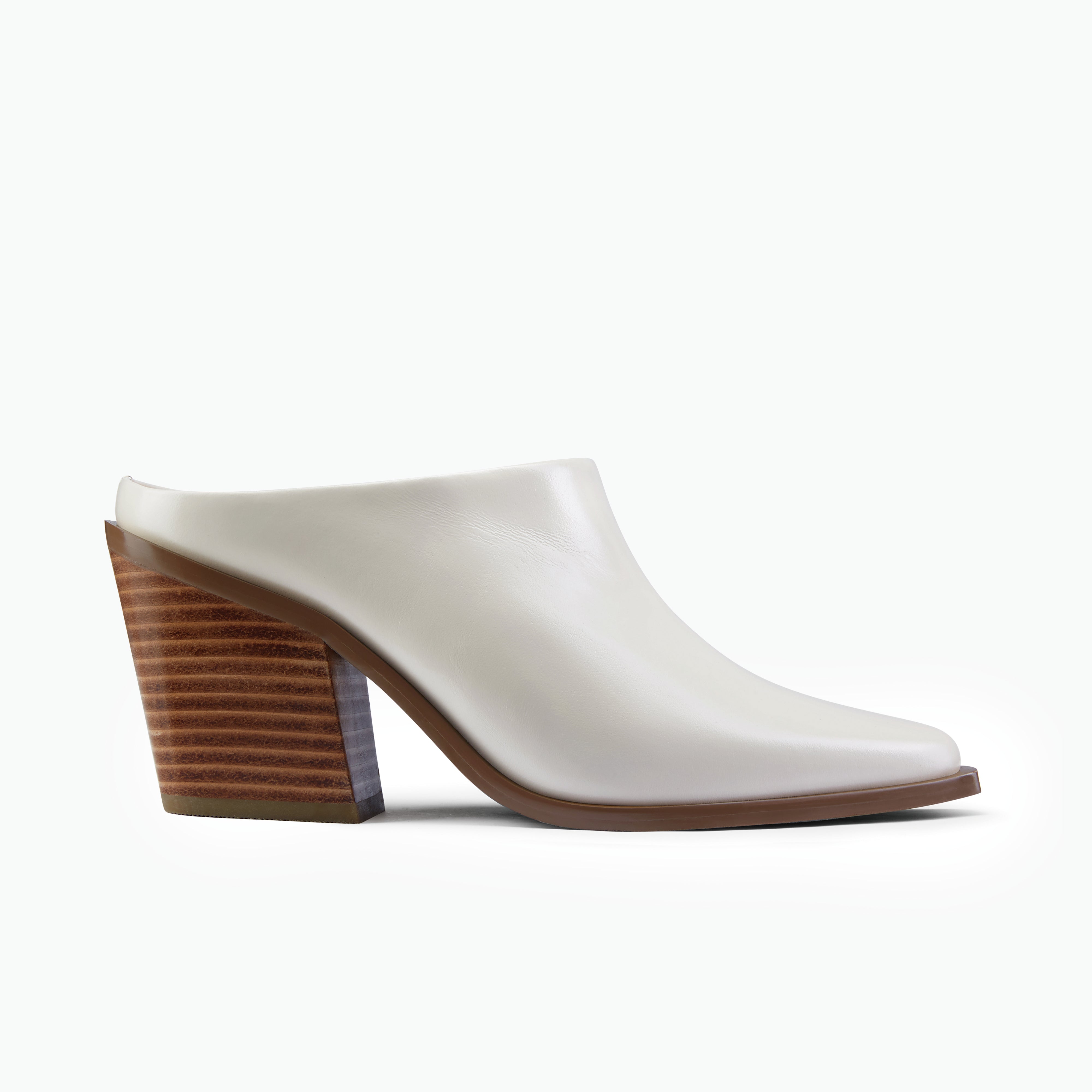 Fabio ivory leather mule with tan stacked leather heel shown from the side.