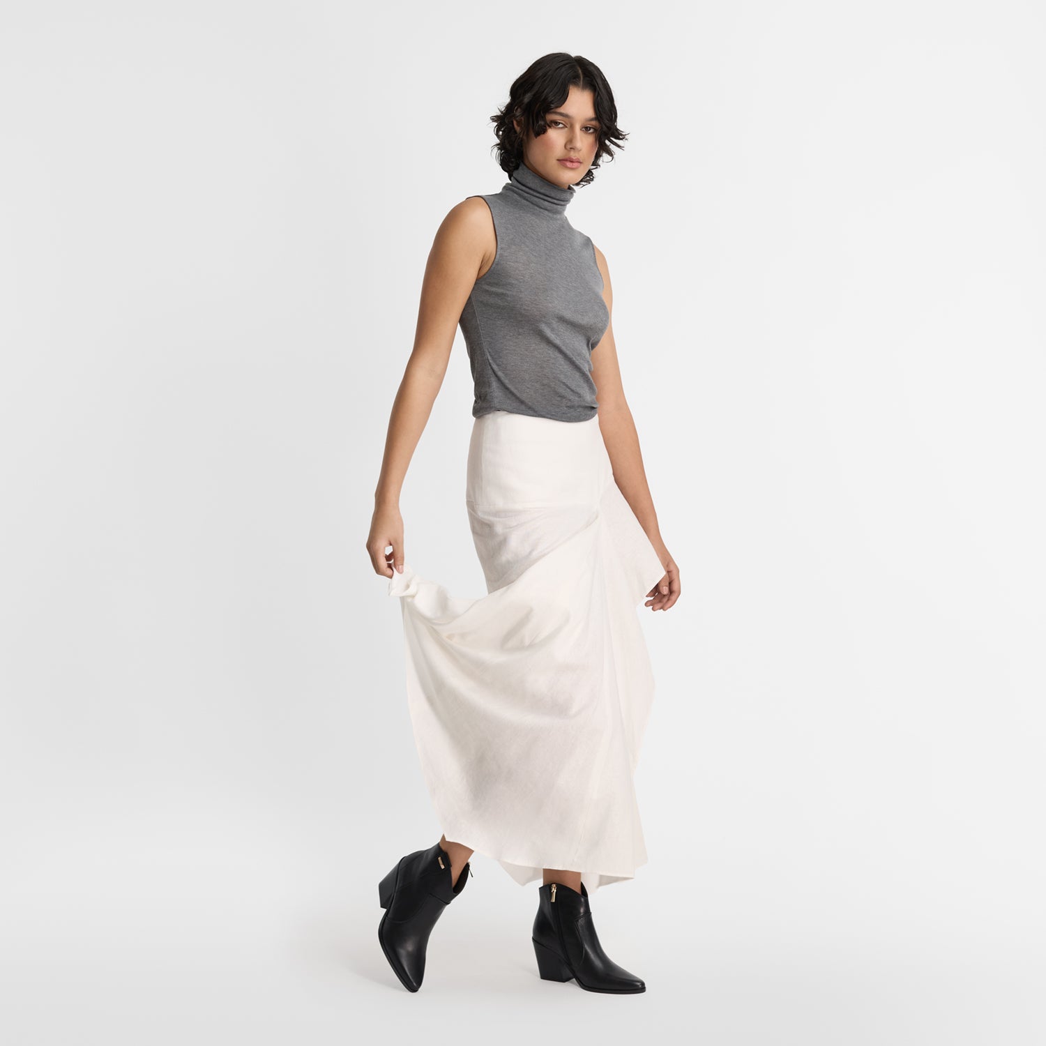 Model wears Nicole Rebstock's black leather ankle boots 