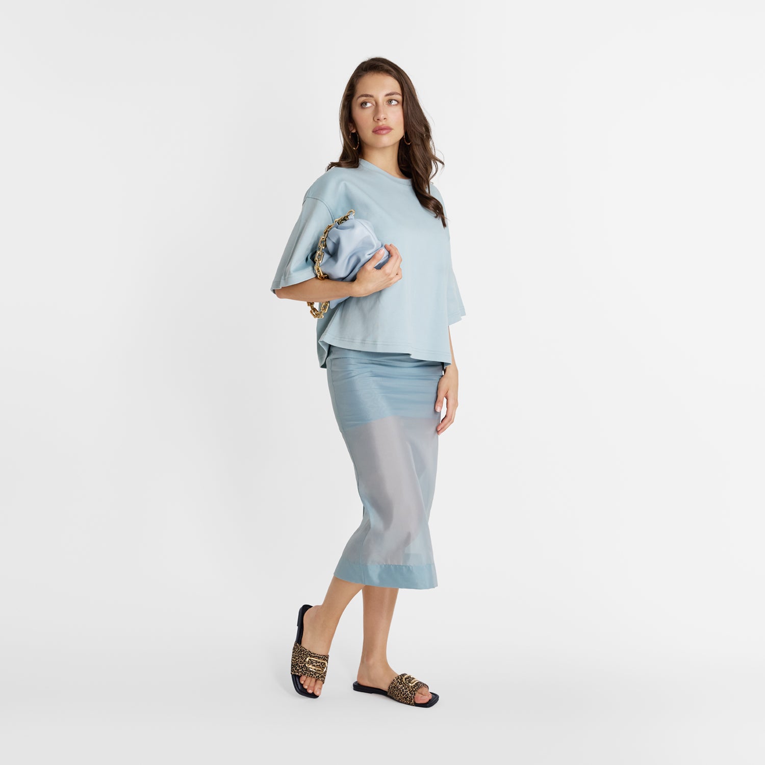 Model wearing Freya Slide by Nicole Rebstock in leopard print with gold metal details