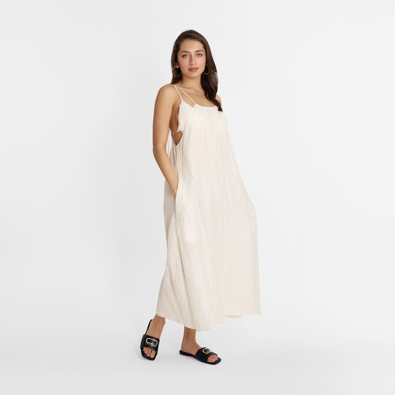 model wearing Nicole Rebstock Freya Slide in black  leather with a square toe 