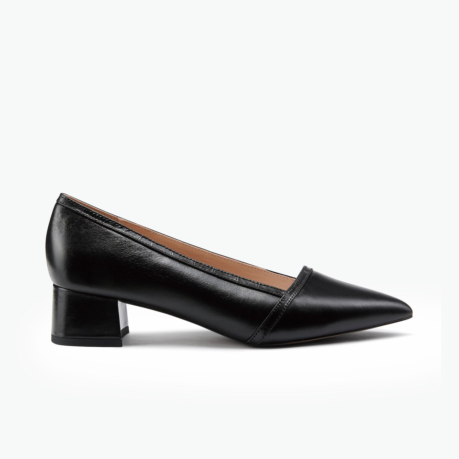 Black leather low heel pointed toe pump with black trim.