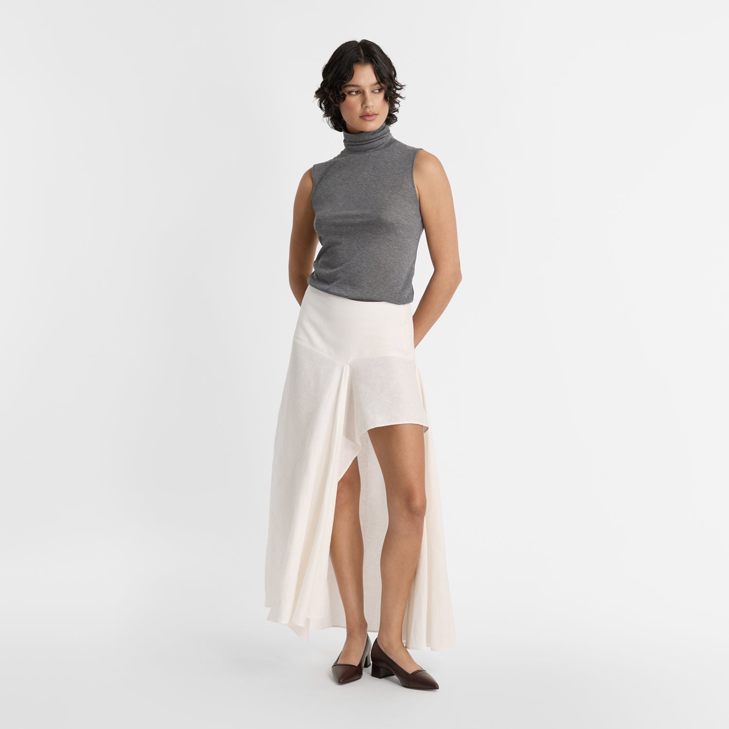 Model wearing brown block heel pumps with 4cm heel.