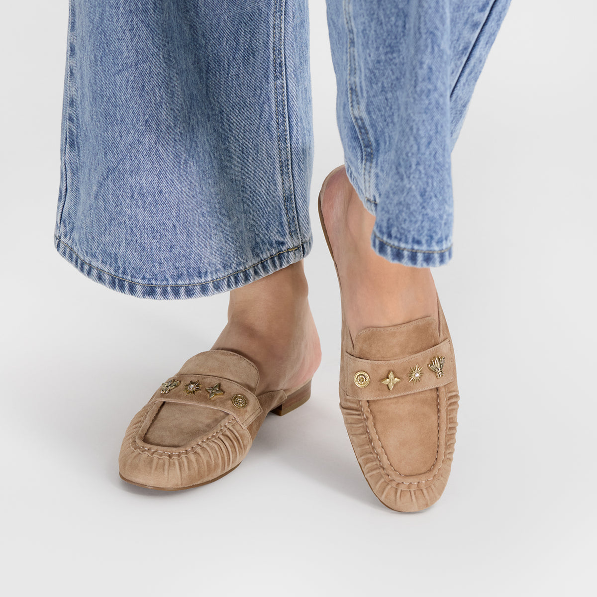 Up close picture of nude suede mules with gathered leather arond the toes.