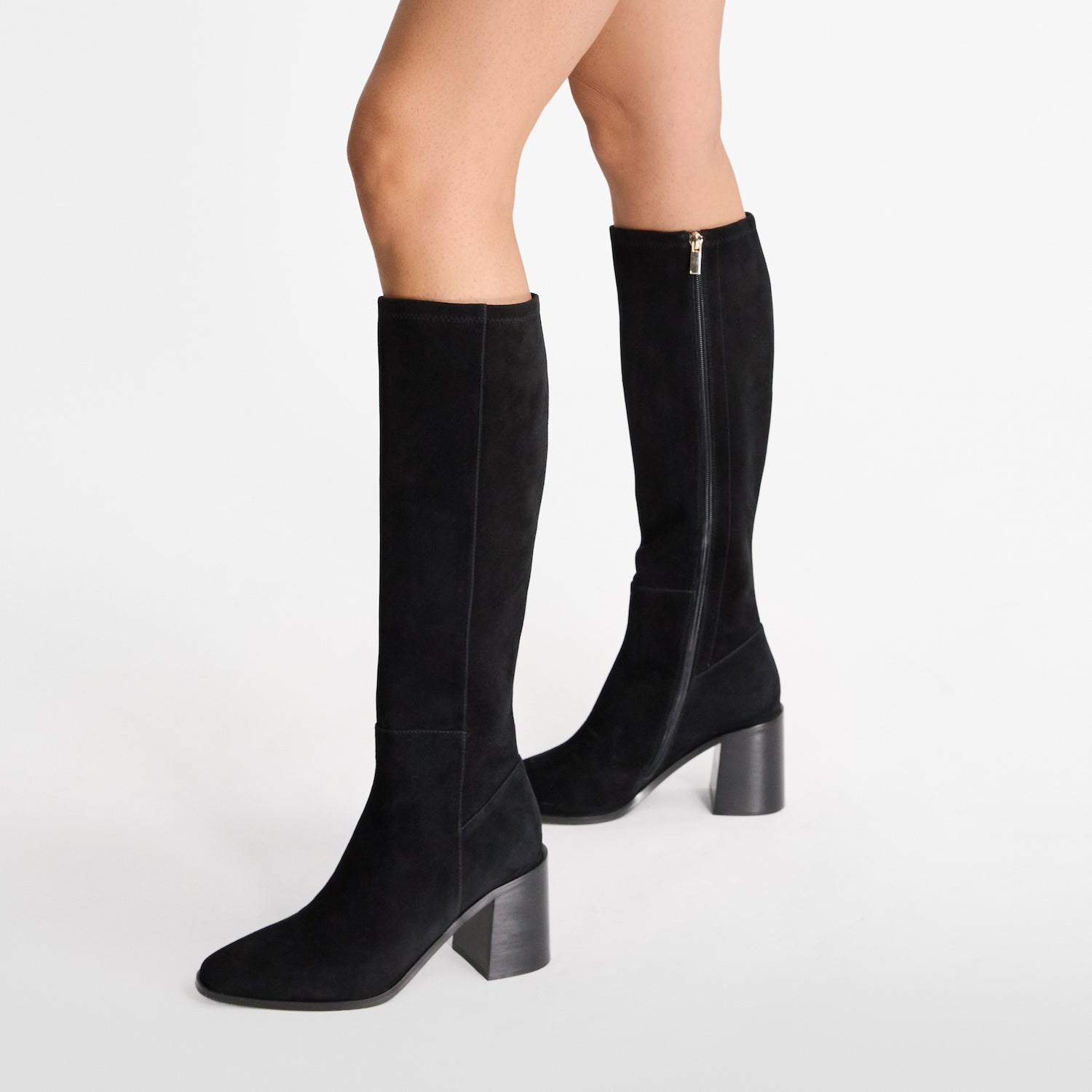 Black suede knee high boot with almond toe by Nicole Rebstockl.