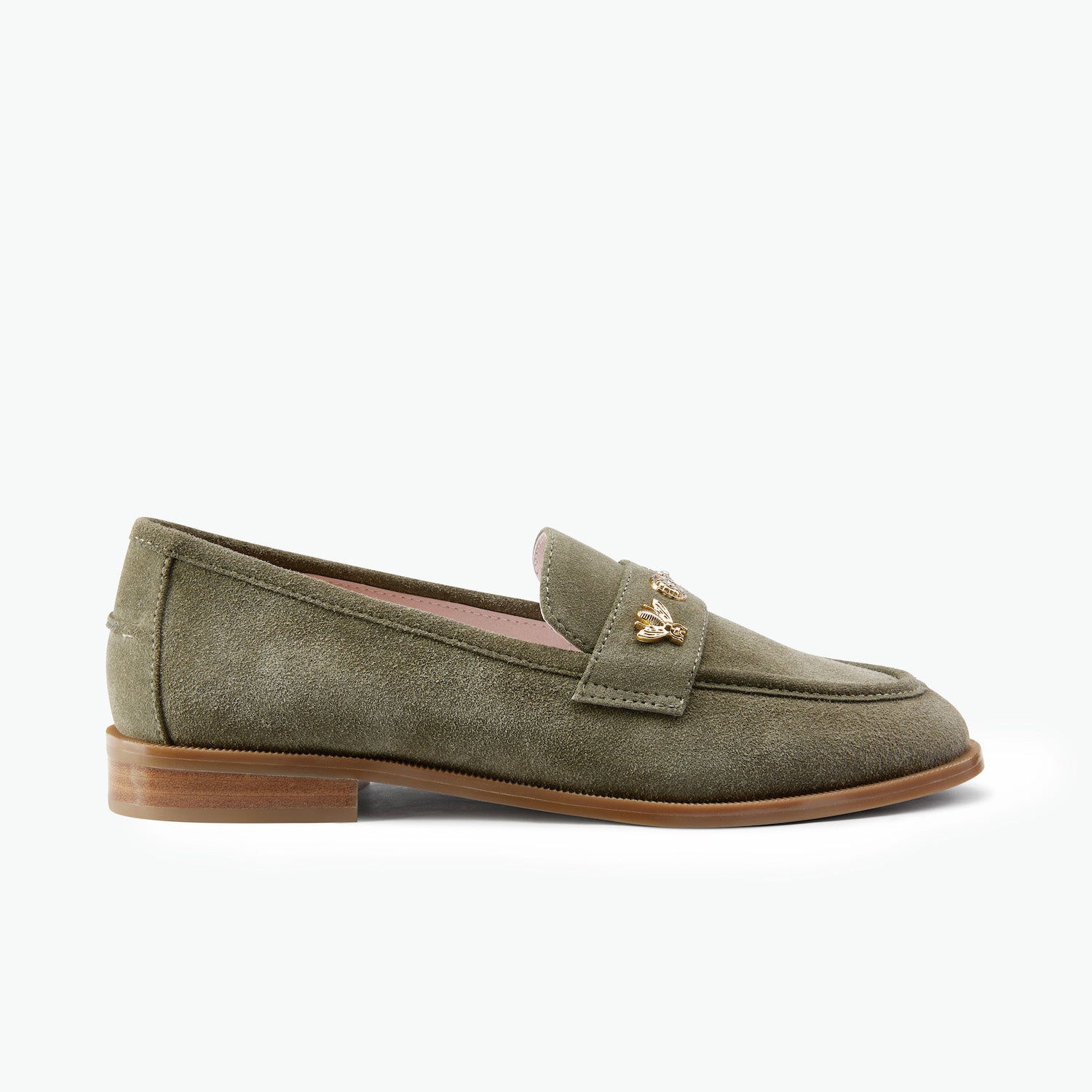 An olive green suede penny loafer with small gold-tone metal studs on the strap, shown in a side profile against a plain white background.