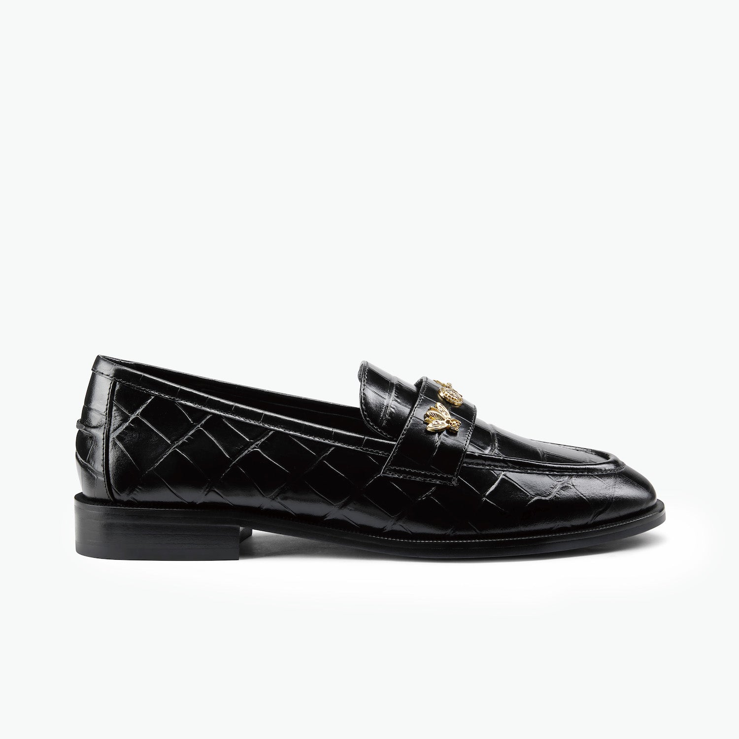 Black croc embossed loafers with gold unique studs. 2.5cm heel and almond toe on a white background. 