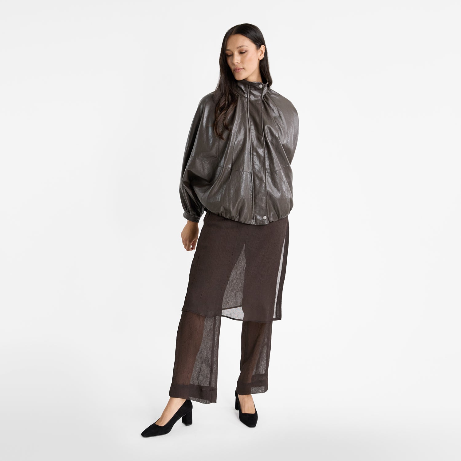 Model wearing Isla pumps in black suede by Nicole Rebstock