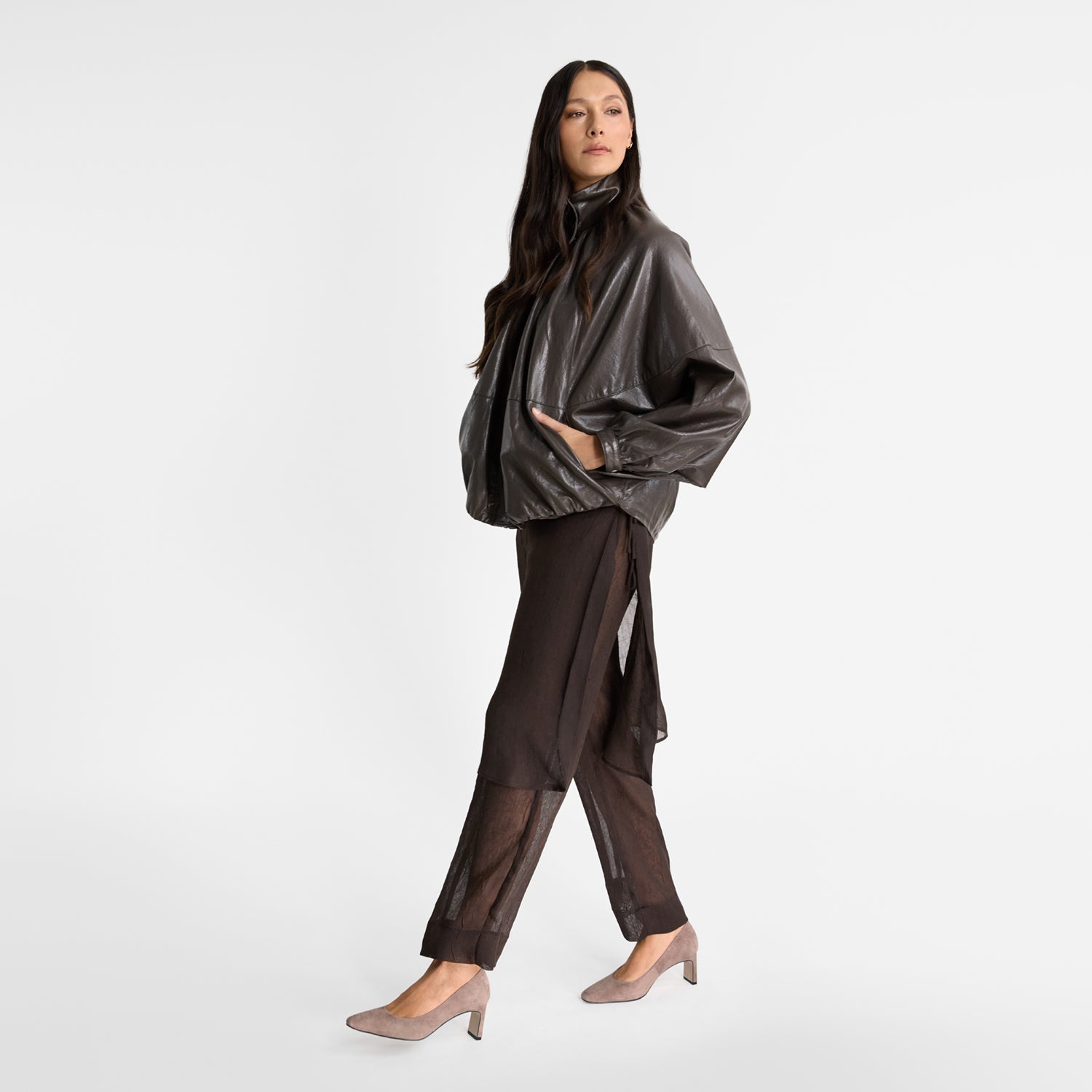 Model wearing Nicole Rebstock's medium height block heel pumps with square toe.