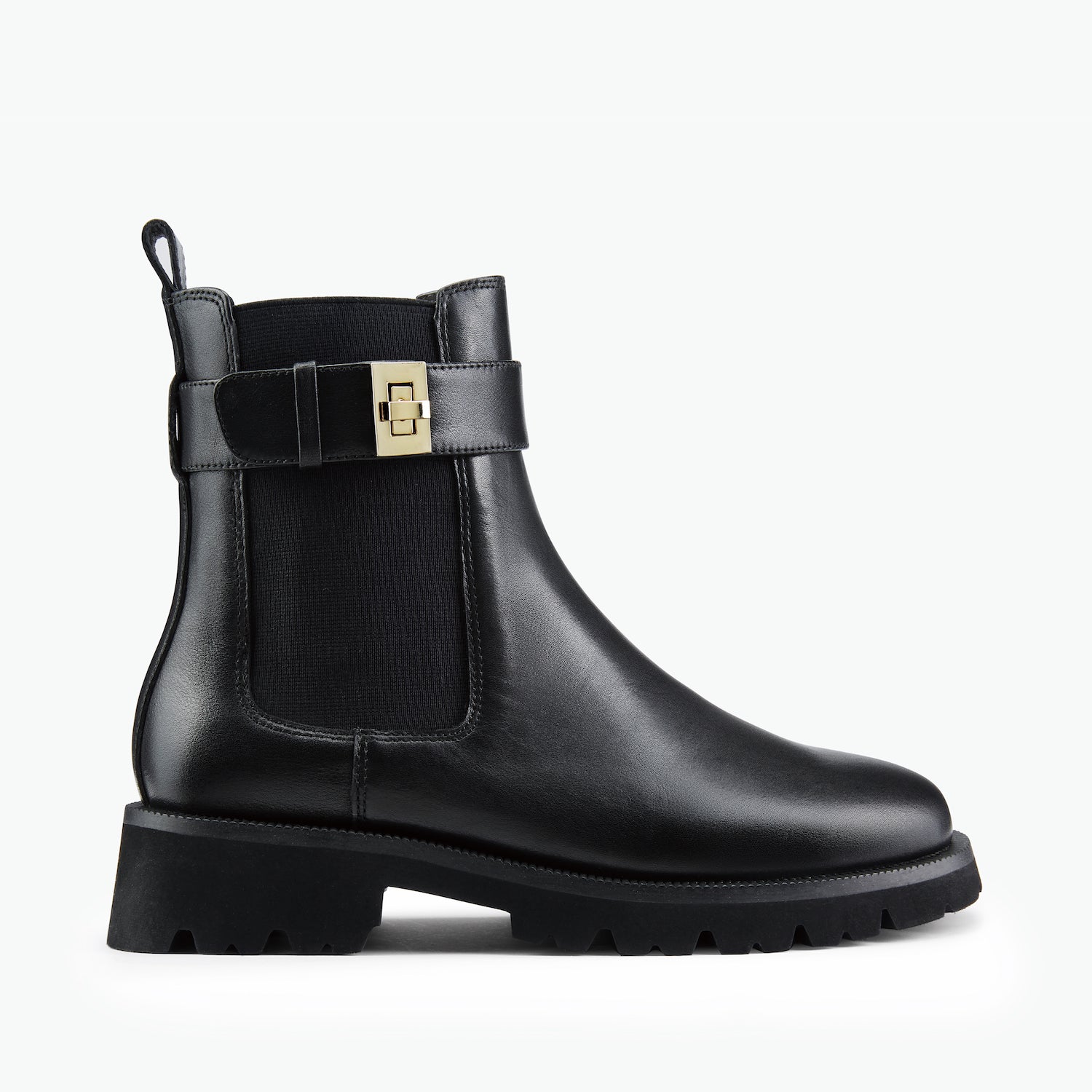 Black boot with a gold buckle on a white background