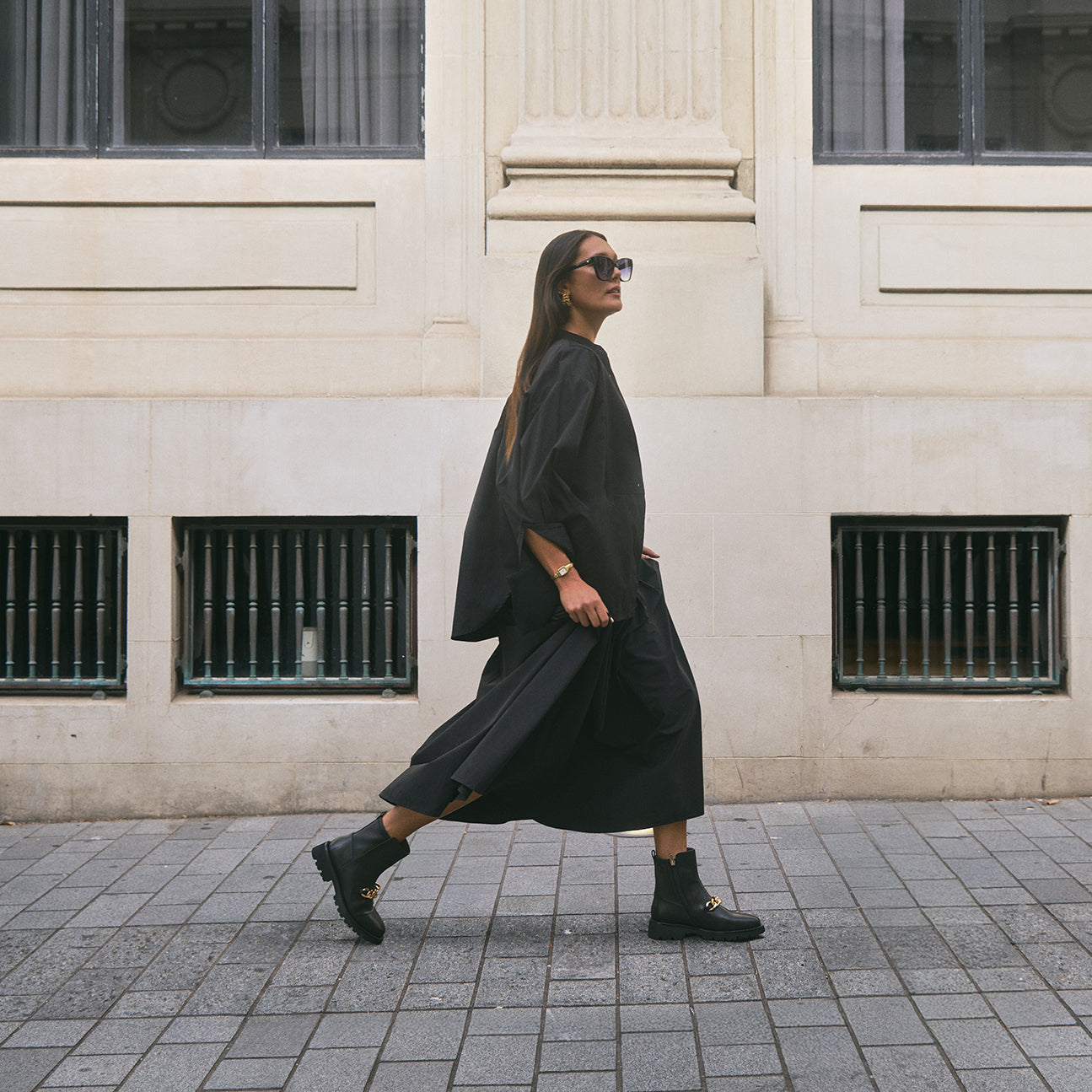 Campaign shot of woman wearing Jimmy Ltd Ed Ankle Boots in urban city.