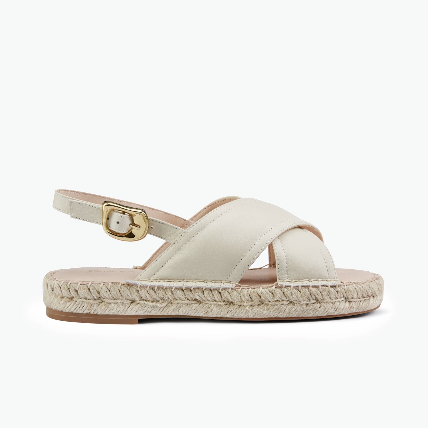 A single women's espadrille sandal in off-white leather with a braided jute platform sole and a gold buckle, shown from a side profile on a light gray background.