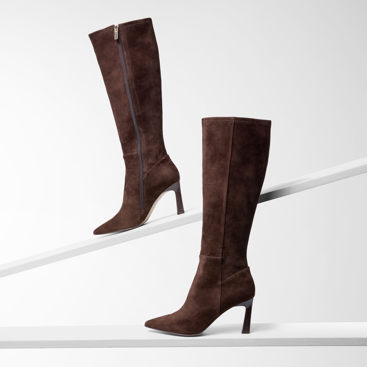 Nicole Rebstock' chocolate brown knee high boots.