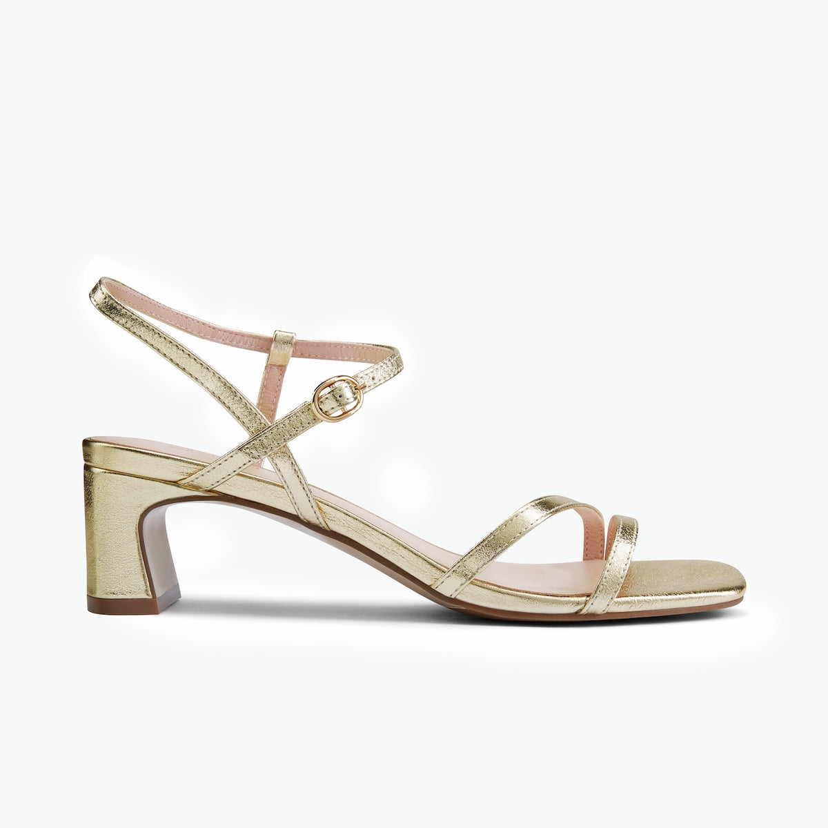 A single metallic gold strappy sandal with a block heel and ankle strap, shown in profile against a plain white background.