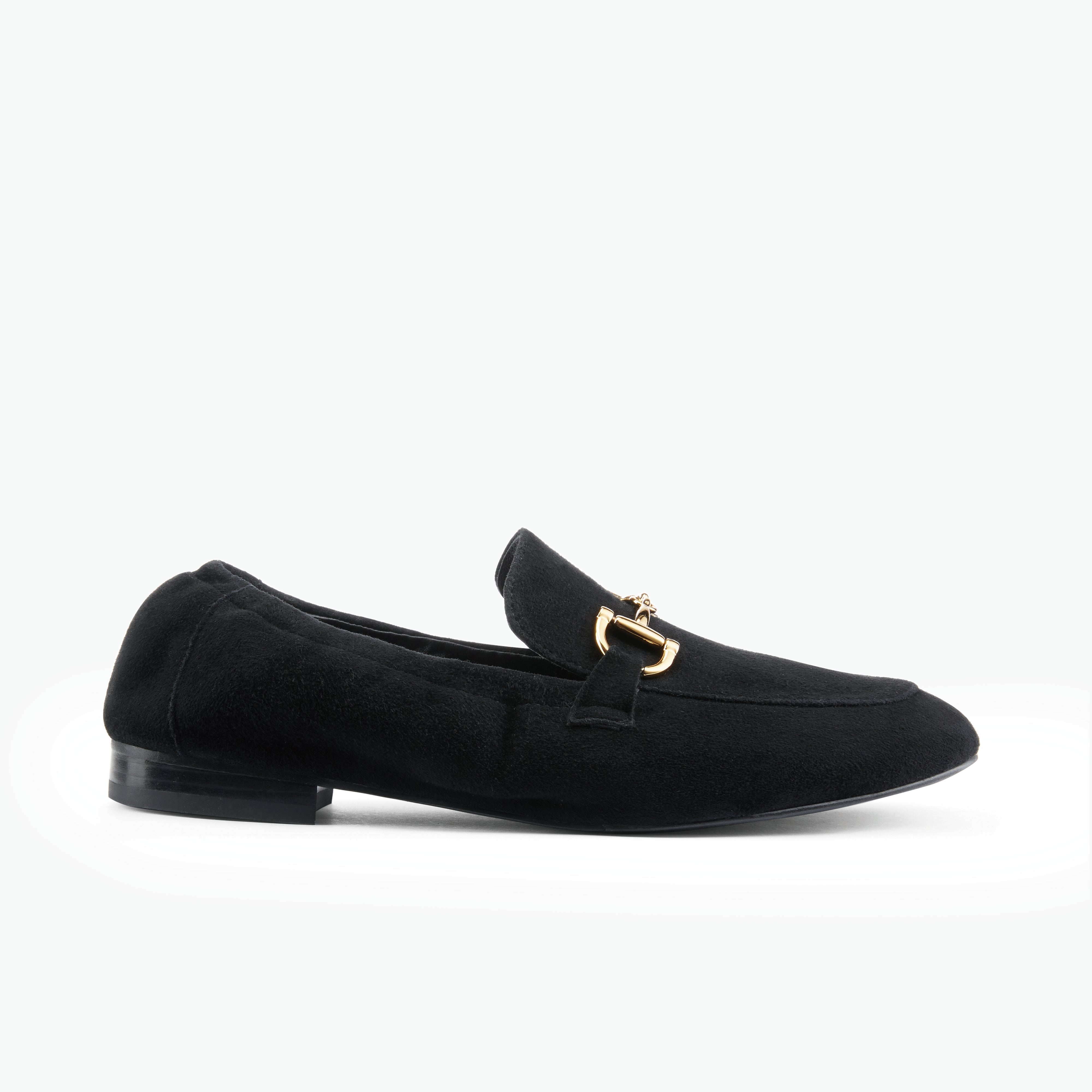 Black suede loafer with gold buckle on white background.