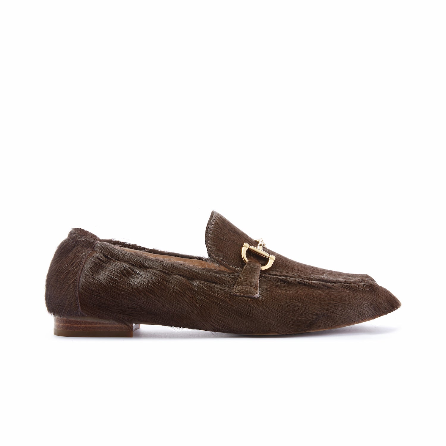Brown calf fur loafer with a gold buckle on a white background