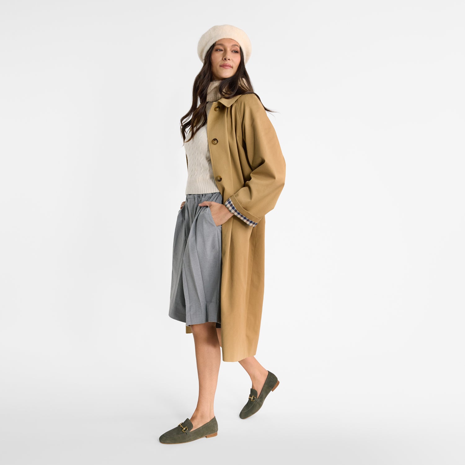 Woman wearing Nicole Rebstock's olive suede loafers with a round toe.