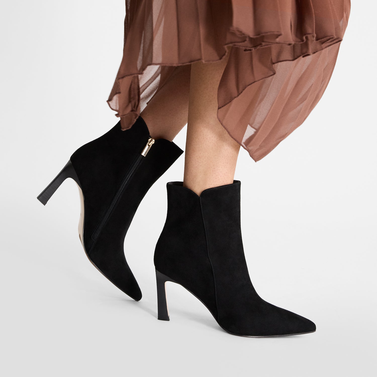 Black stiletto boots called Mila by Nicole Rebstock worn by model