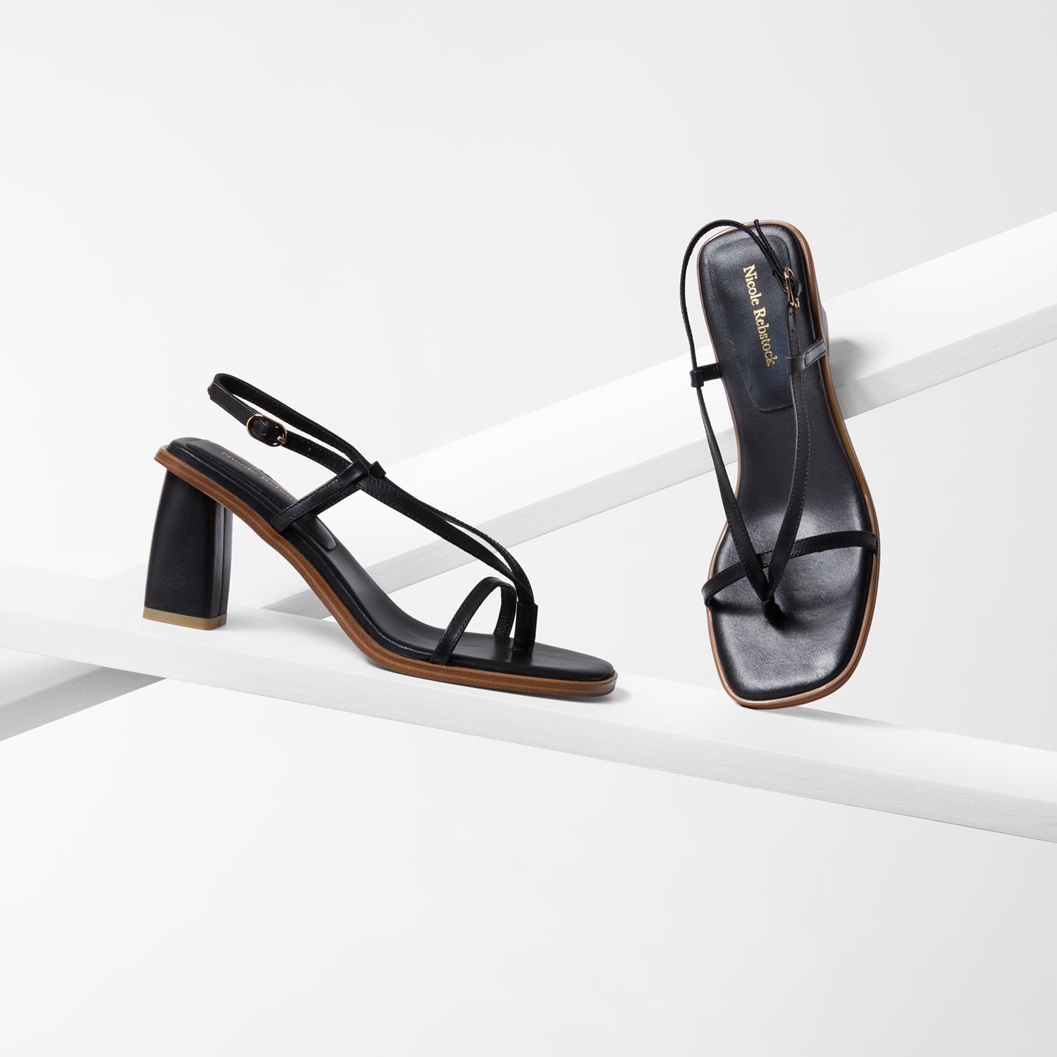 Black Milla sandal heel with a black sole, top and side profiles 