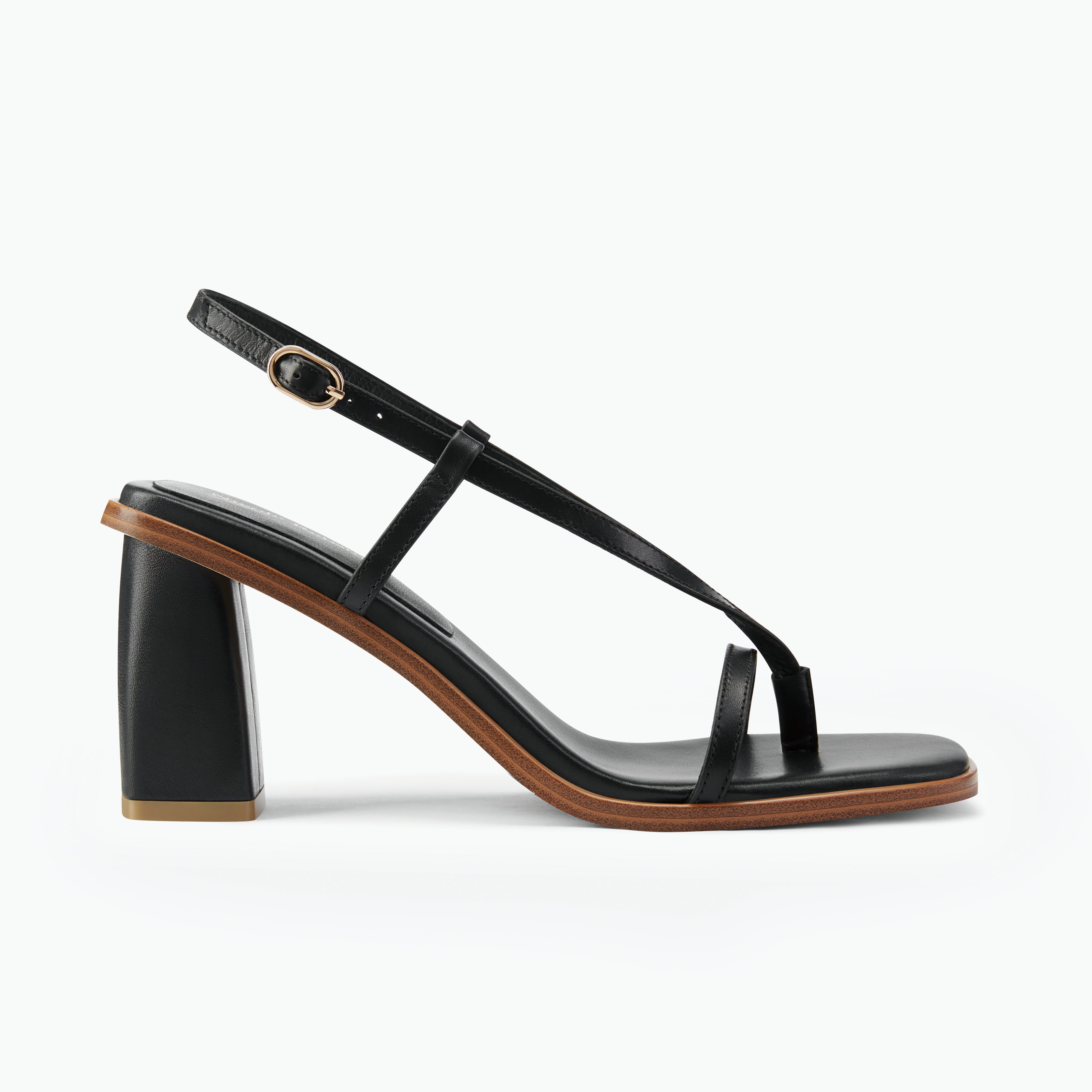 Black strappy sandal with 7cm block heel by Nicole Rebstock. Side profile.