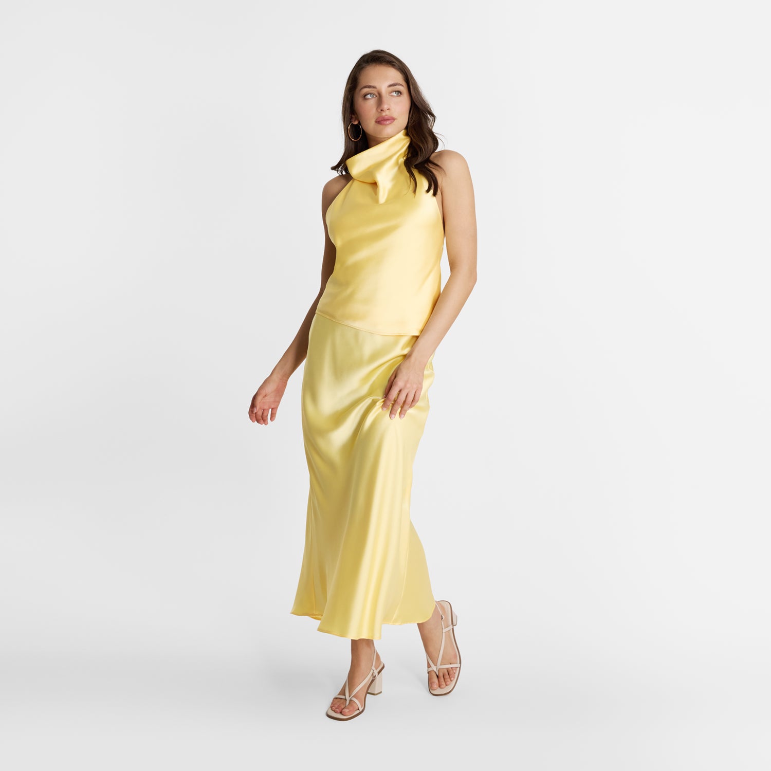 Model wearing Nicole Rebstock Milla ivory sandals