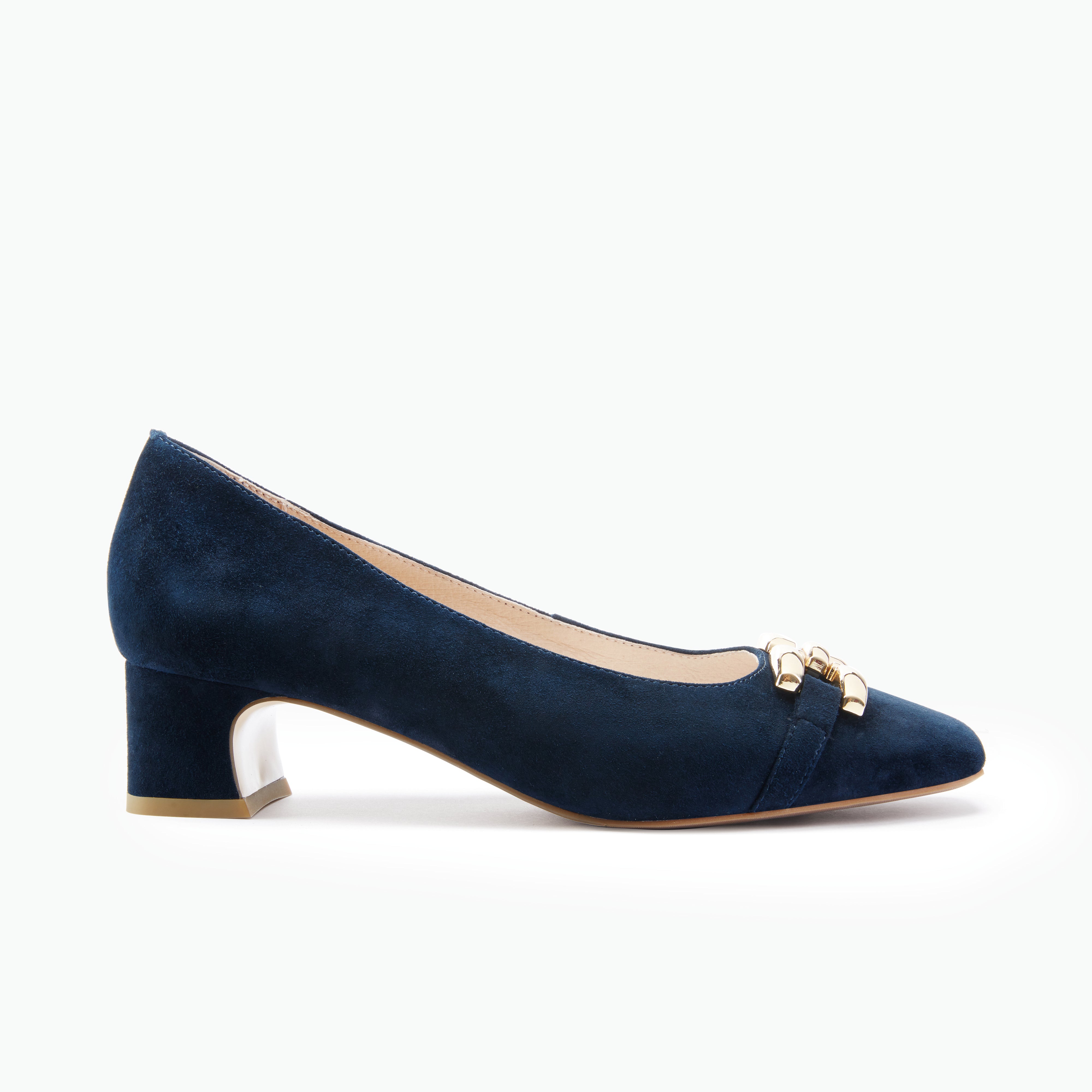 Navy blue suede shoe with gold accents on a white background