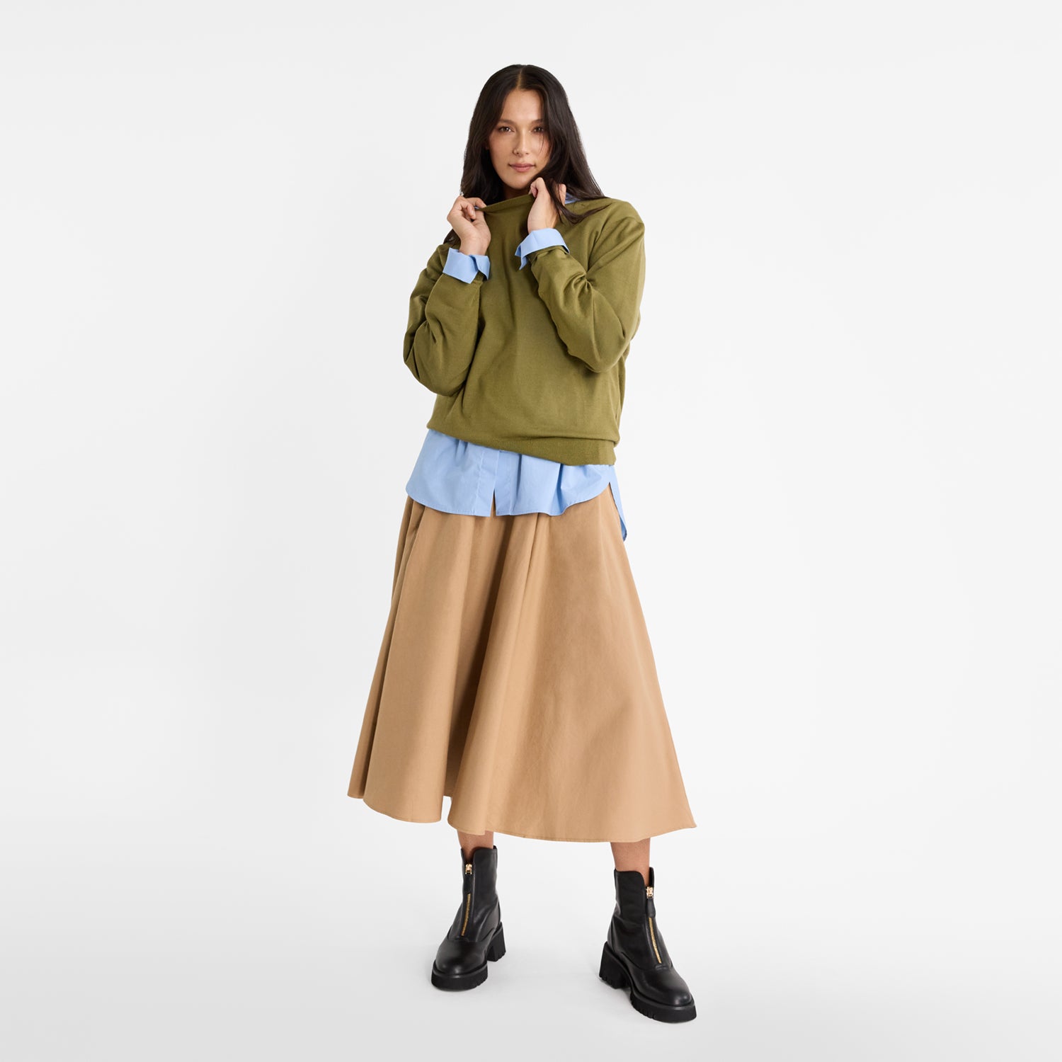 Model wearing Nicole Rebstock's black Nola Ankle boots with thick thread and gold zips. 5cm heel.