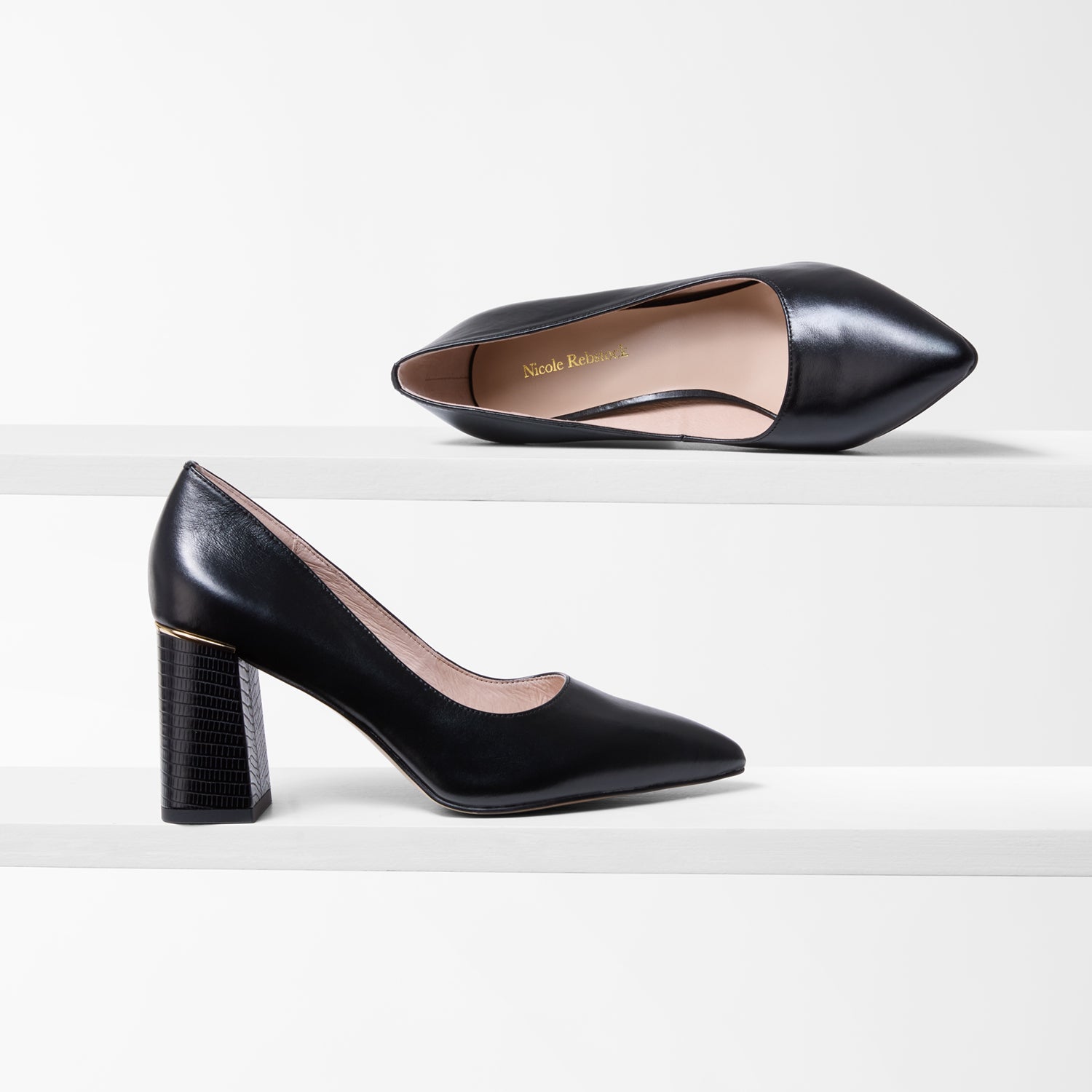 Black pointed pumps. Medium height heel. By Nicole Rebstock.