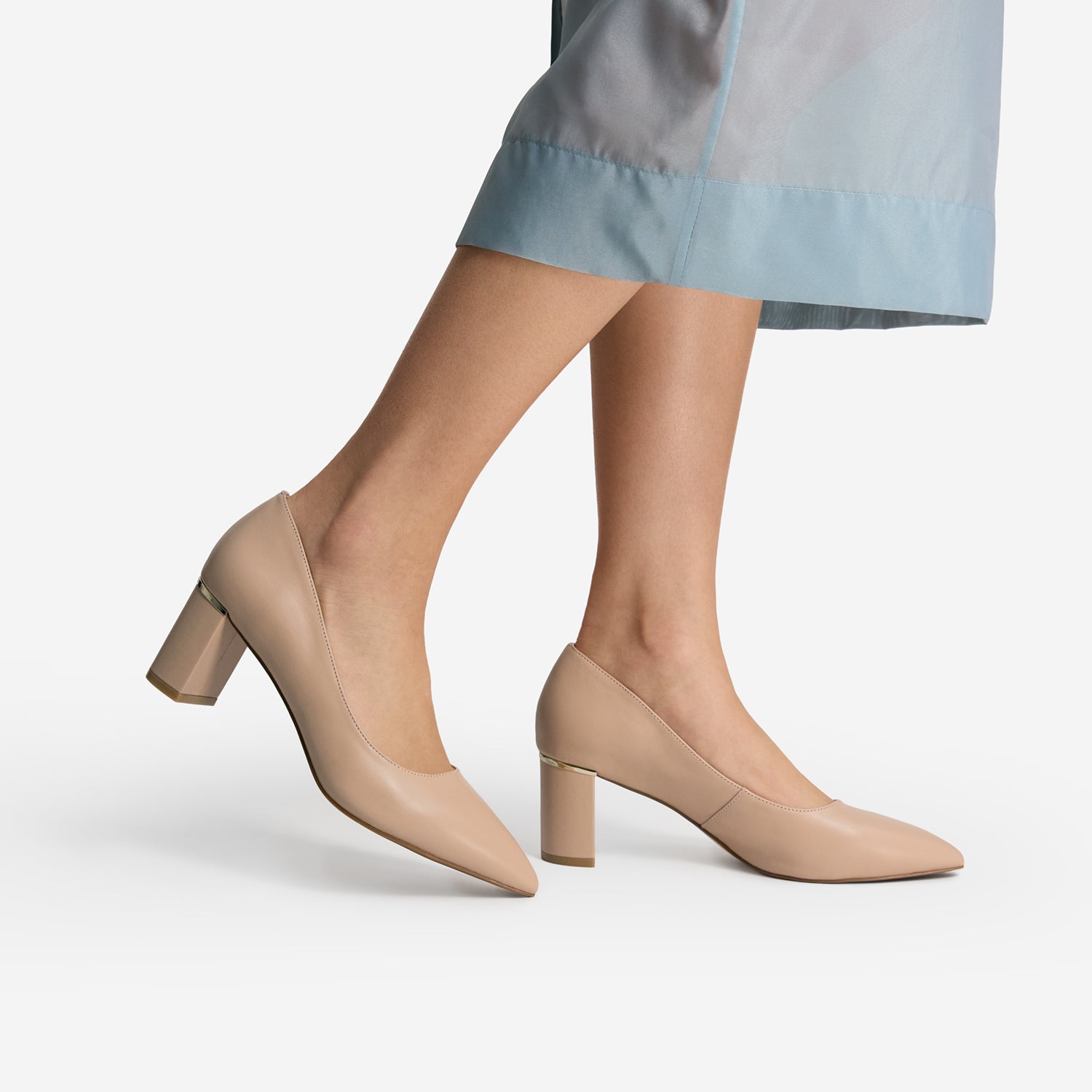 Up close view of women wearing neutral coloured Olive pumps by Nicole Rebstock. 6cm Heel.