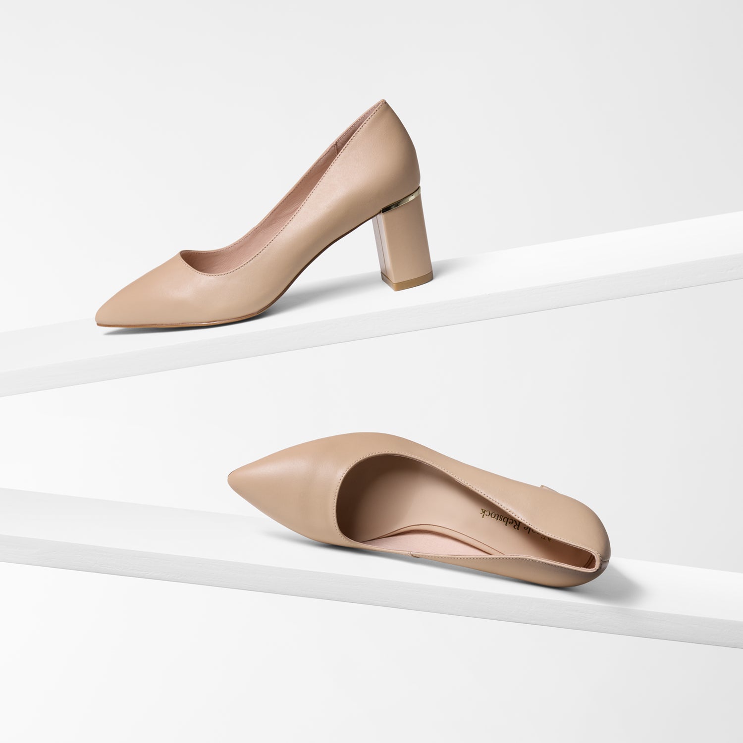 Nude block heel pointed shoes on a white background by Nicole Rebstock