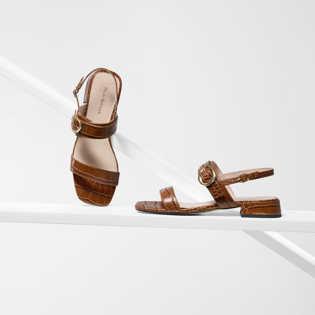 Tan sandals with slingback strap and gold hardware by Nicole Rebstock. 2.5cm block heel.
