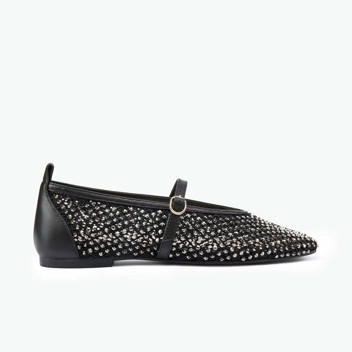 Pair of black fabric and leather mary jane flats with silver crystals on a white background.