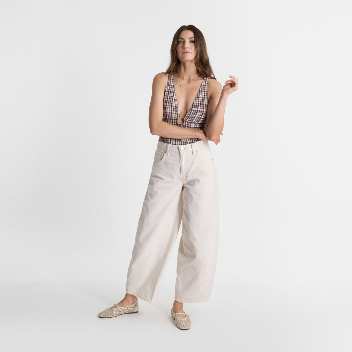 Model wearing Nicole Rebstock's Tahlia ivory flats.